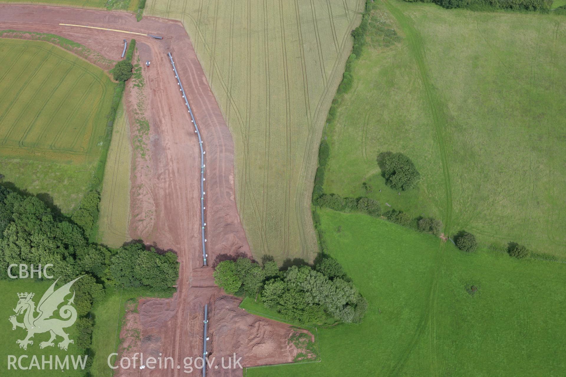 RCAHMW colour oblique aerial photograph of Pipton Chambered Long Cairn. Taken on 09 July 2007 by Toby Driver