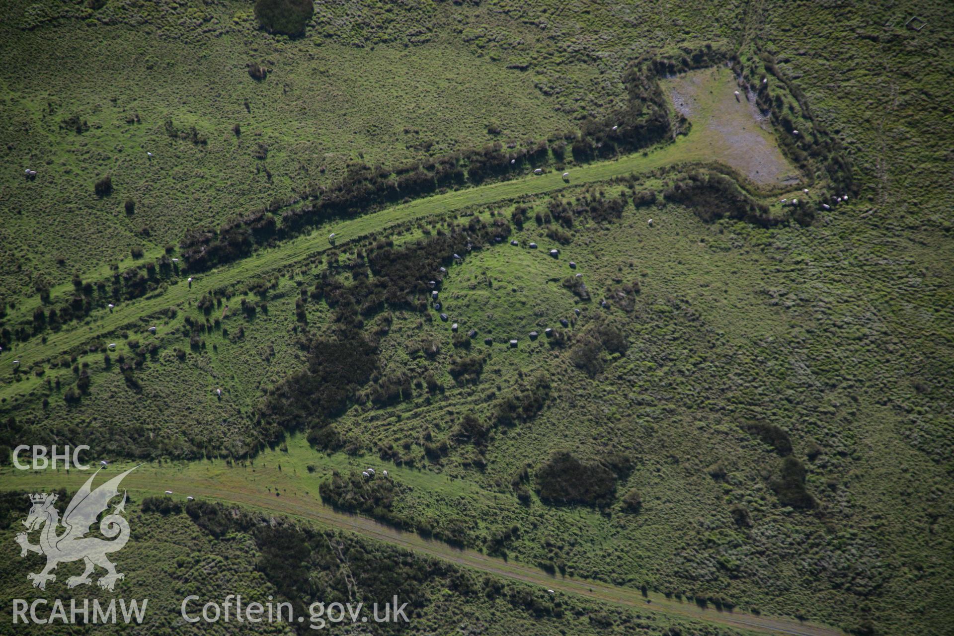 RCAHMW colour oblique aerial photograph of Twyn Cerrig-Cadarn Cairn. Taken on 08 August 2007 by Toby Driver