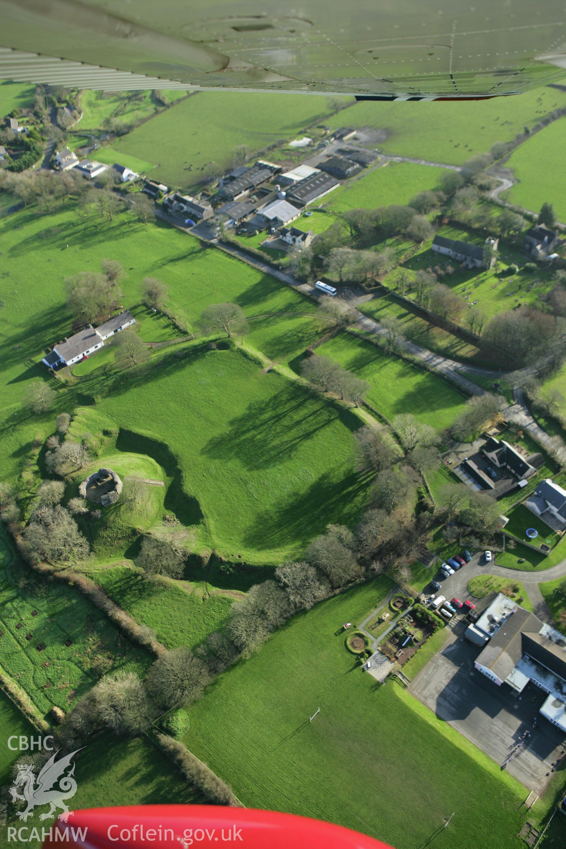 RCAHMW colour oblique photograph of Wiston Castle, and village. Taken by Toby Driver on 29/11/2007.