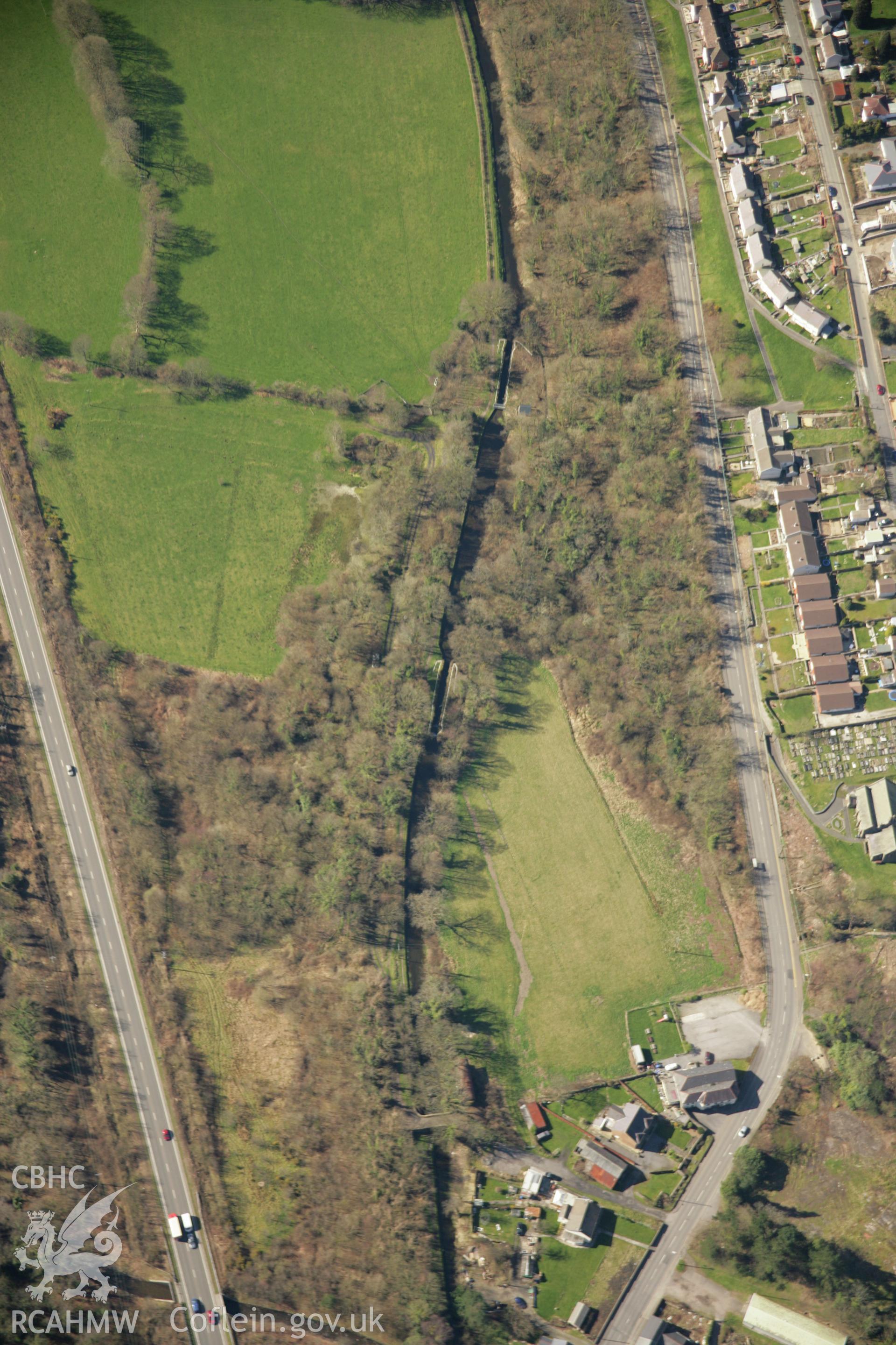 RCAHMW colour oblique aerial photograph of Ynysmeudwy Upper Lock 13, Swansea Canal. Taken on 21 March 2007 by Toby Driver