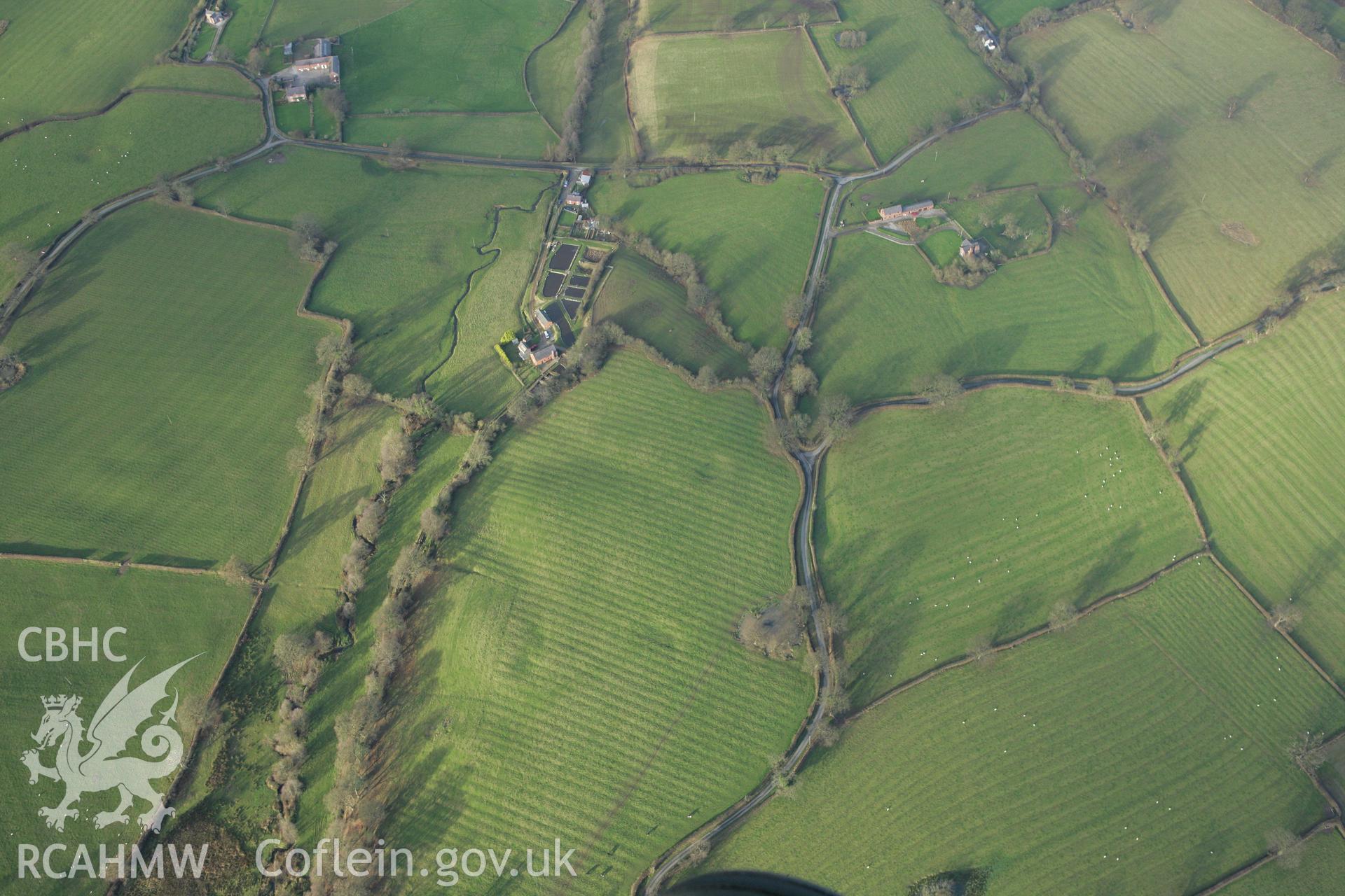 RCAHMW colour oblique photograph of Peartree Farmhouse;Peartree Farmhouse field systems, view from south. Taken by Toby Driver on 11/12/2007.