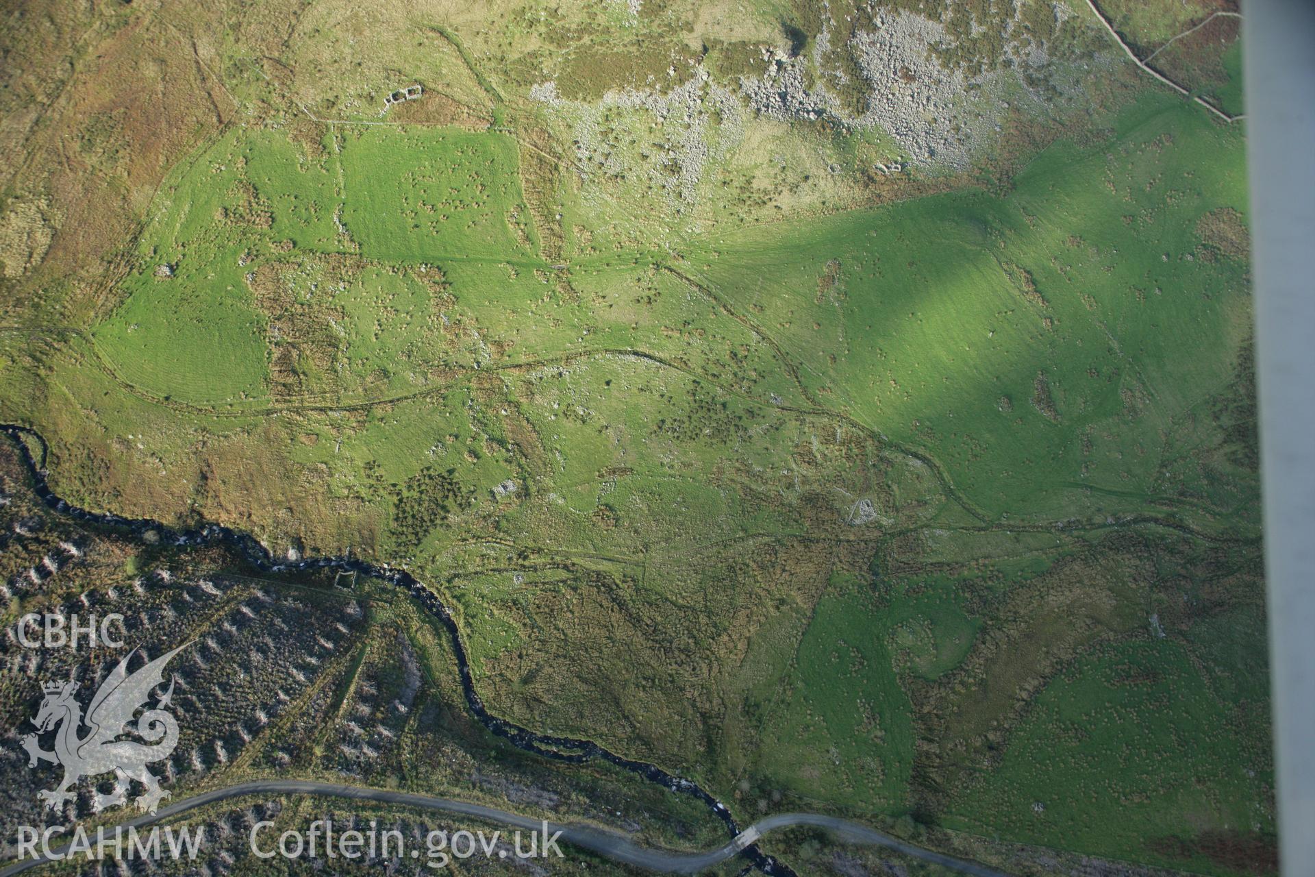 RCAHMW colour oblique photograph of Moel Caws hut group. Taken by Toby Driver on 30/10/2007.