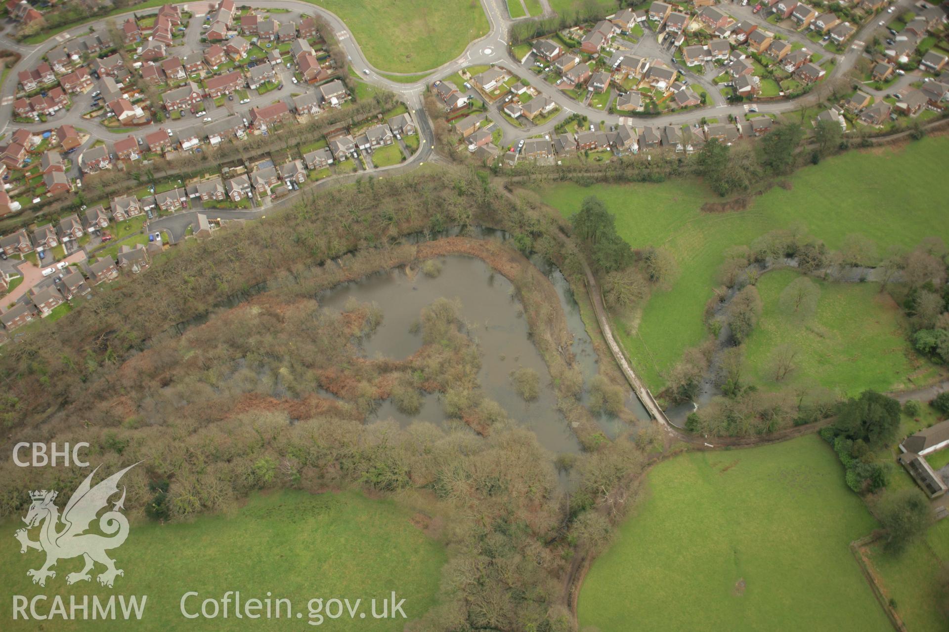 RCAHMW colour oblique aerial photograph of Afon Clydach Dam at Neath Abbey Ironworks. Taken on 16 March 2007 by Toby Driver