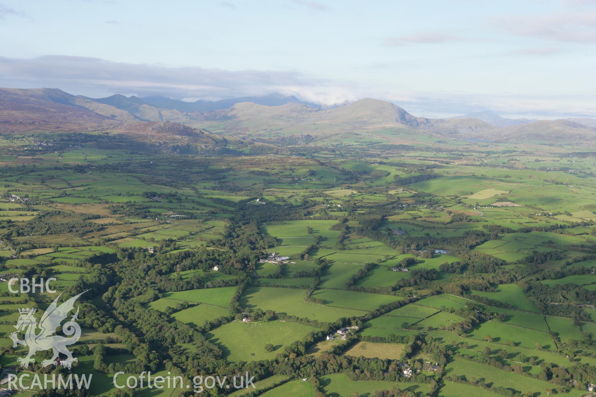 RCAHMW colour oblique aerial photograph of Trefan Hall and the surrounding landscape from the south. Taken on 06 September 2007 by Toby Driver