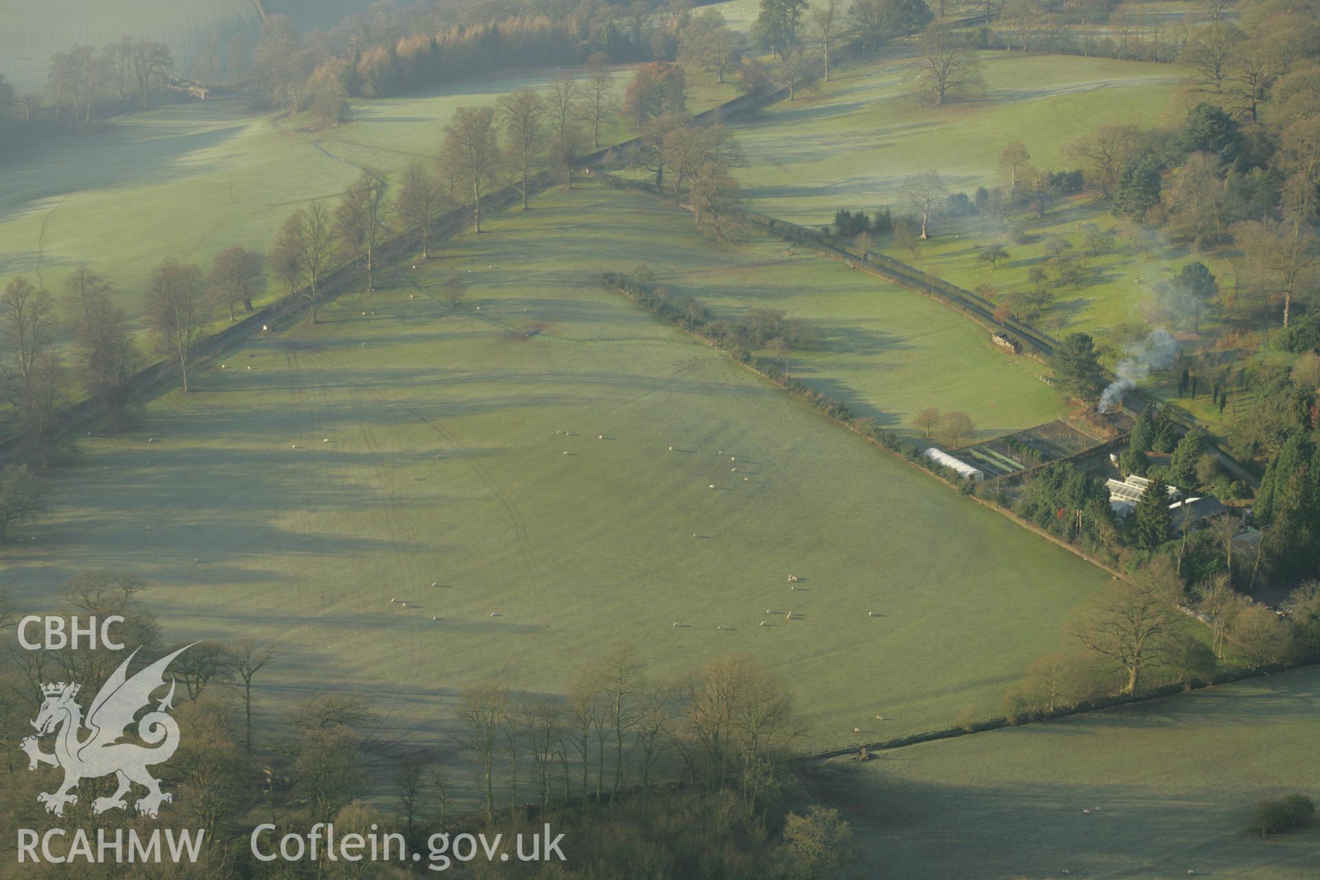 RCAHMW colour oblique aerial photograph of Powis Castle Park and Gardens, Welshpool, showing ridge and furrow marks below the castle. Taken on 25 January 2007 by Toby Driver