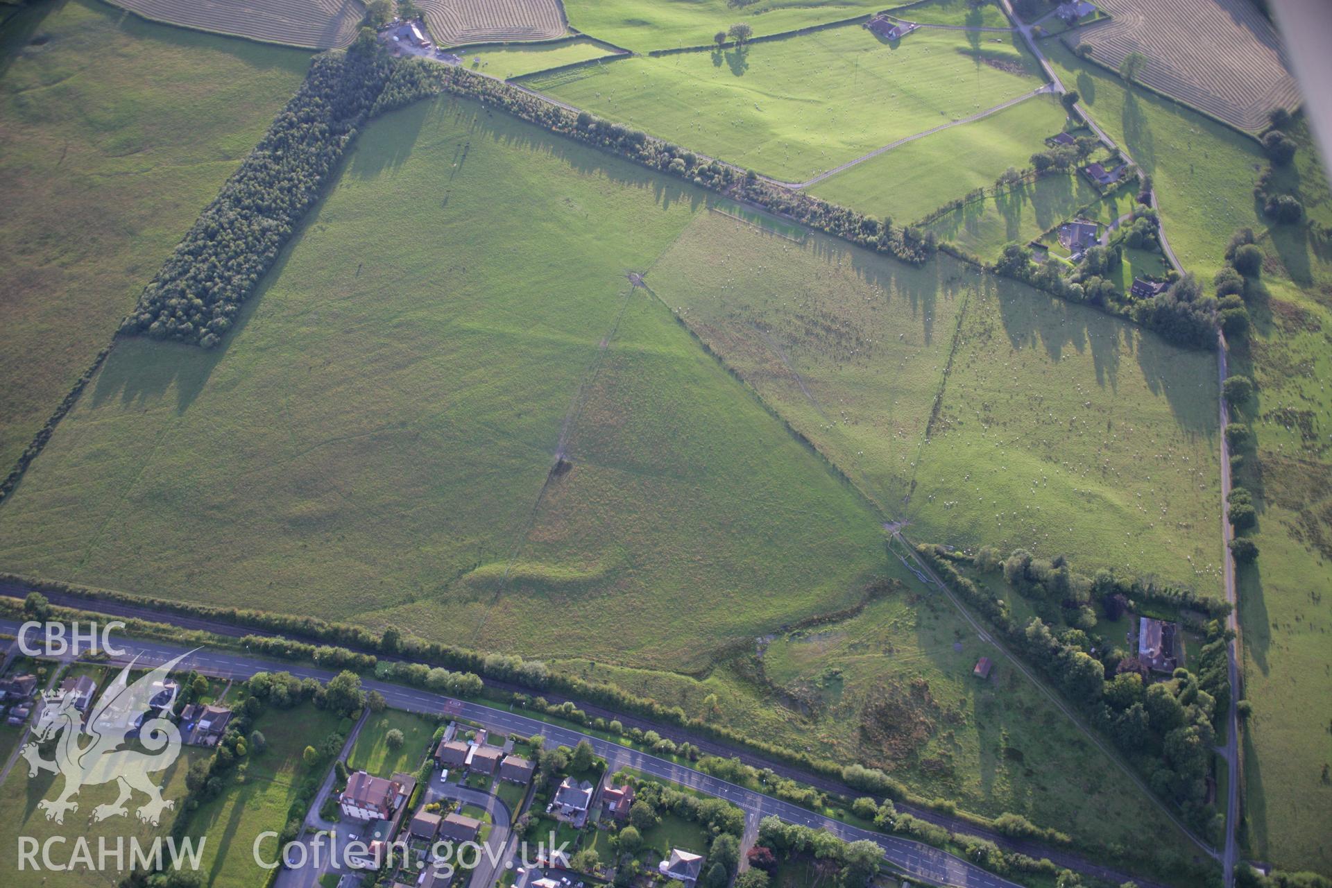 RCAHMW colour oblique aerial photograph of Llandrindod Common Roman Camp XV. Taken on 08 August 2007 by Toby Driver