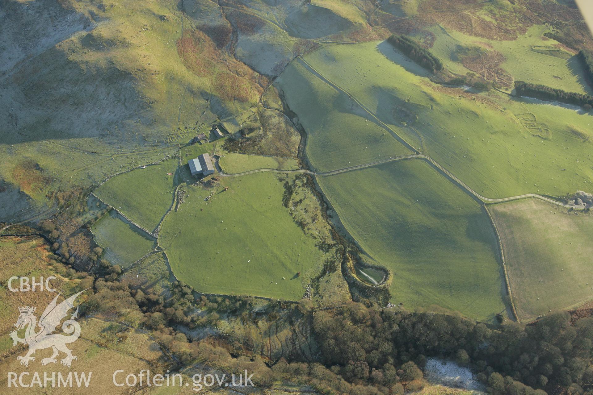 RCAHMW colour oblique photograph of Frongoch farmstead, showing relict field systems to the west. Taken by Toby Driver on 20/12/2007.