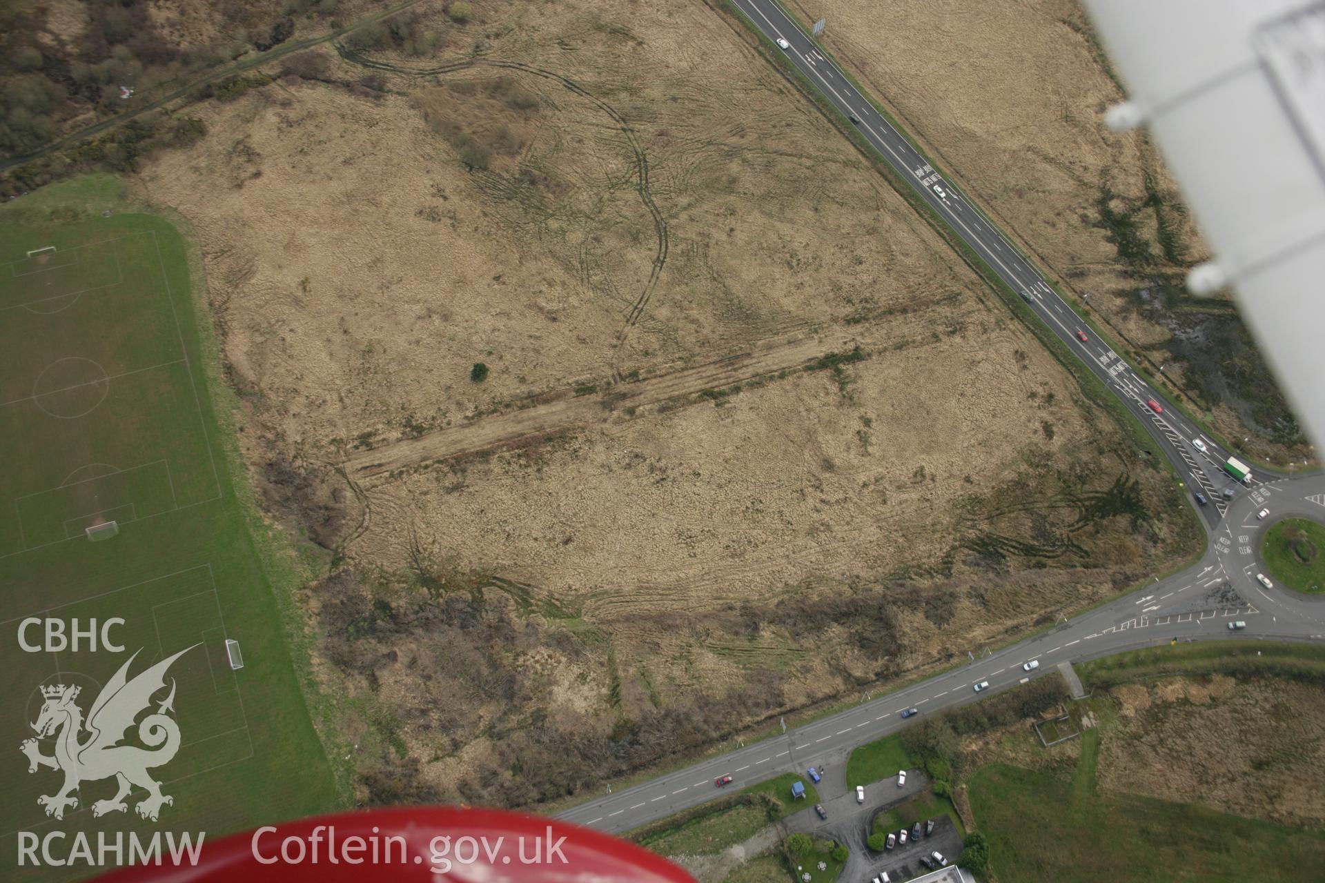 RCAHMW colour oblique aerial photograph of Roman military enclosure on Stafford Common. Taken on 16 March 2007 by Toby Driver