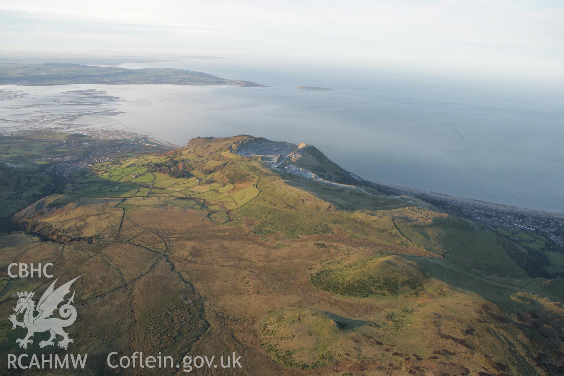 RCAHMW colour oblique photograph of Penmaenmawr, showing a winter landscape over Braich y Dinas. Taken by Toby Driver on 20/12/2007.