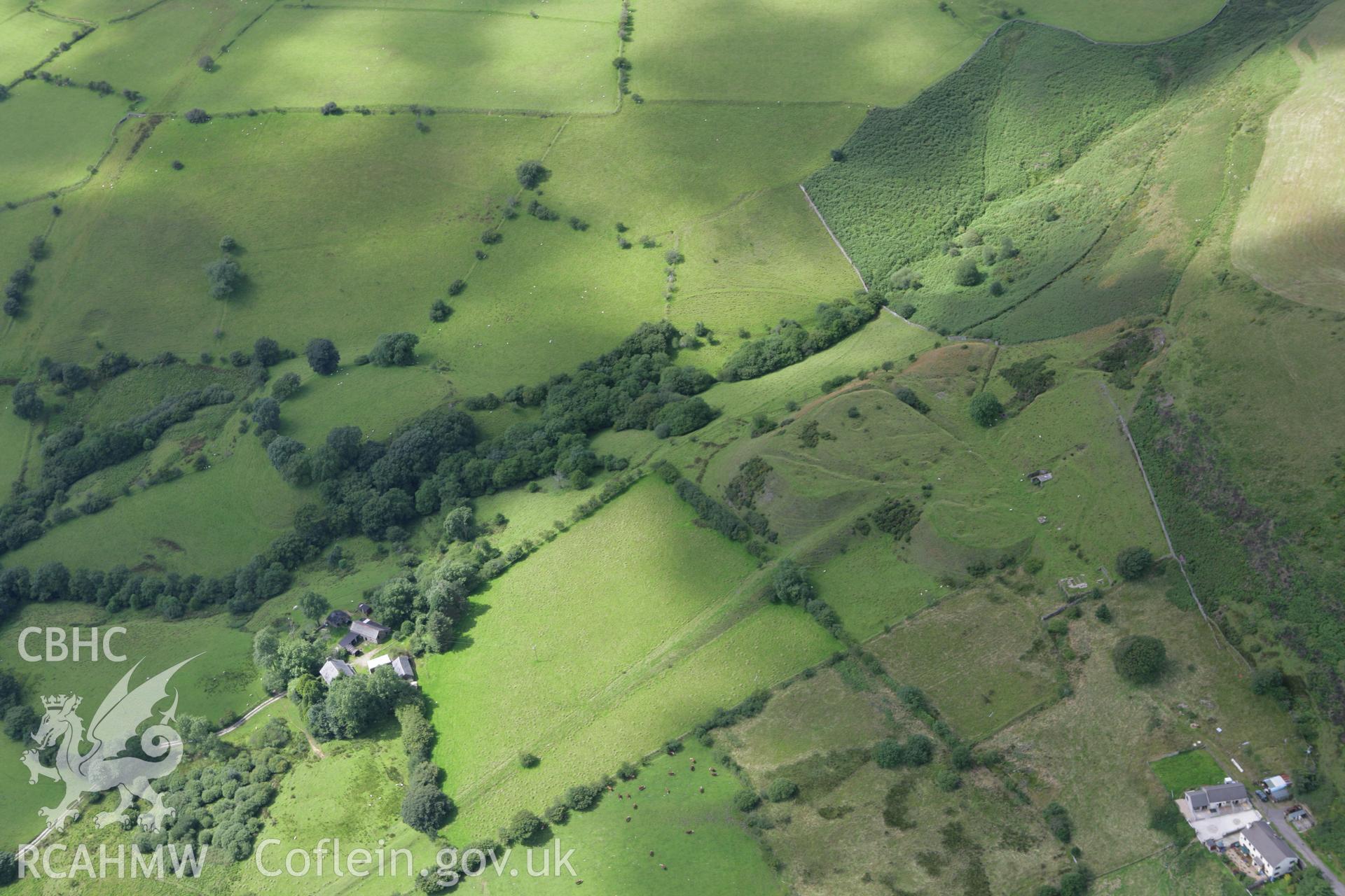 RCAHMW colour oblique aerial photograph of Ty'n-y-Waun Enclosure Cwm Llwyd. Taken on 30 July 2007 by Toby Driver