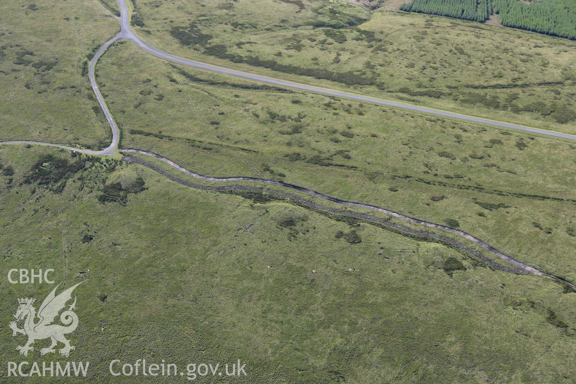 RCAHMW colour oblique aerial photograph of Tri Chrugiau Cairn I, II and III. Taken on 08 August 2007 by Toby Driver