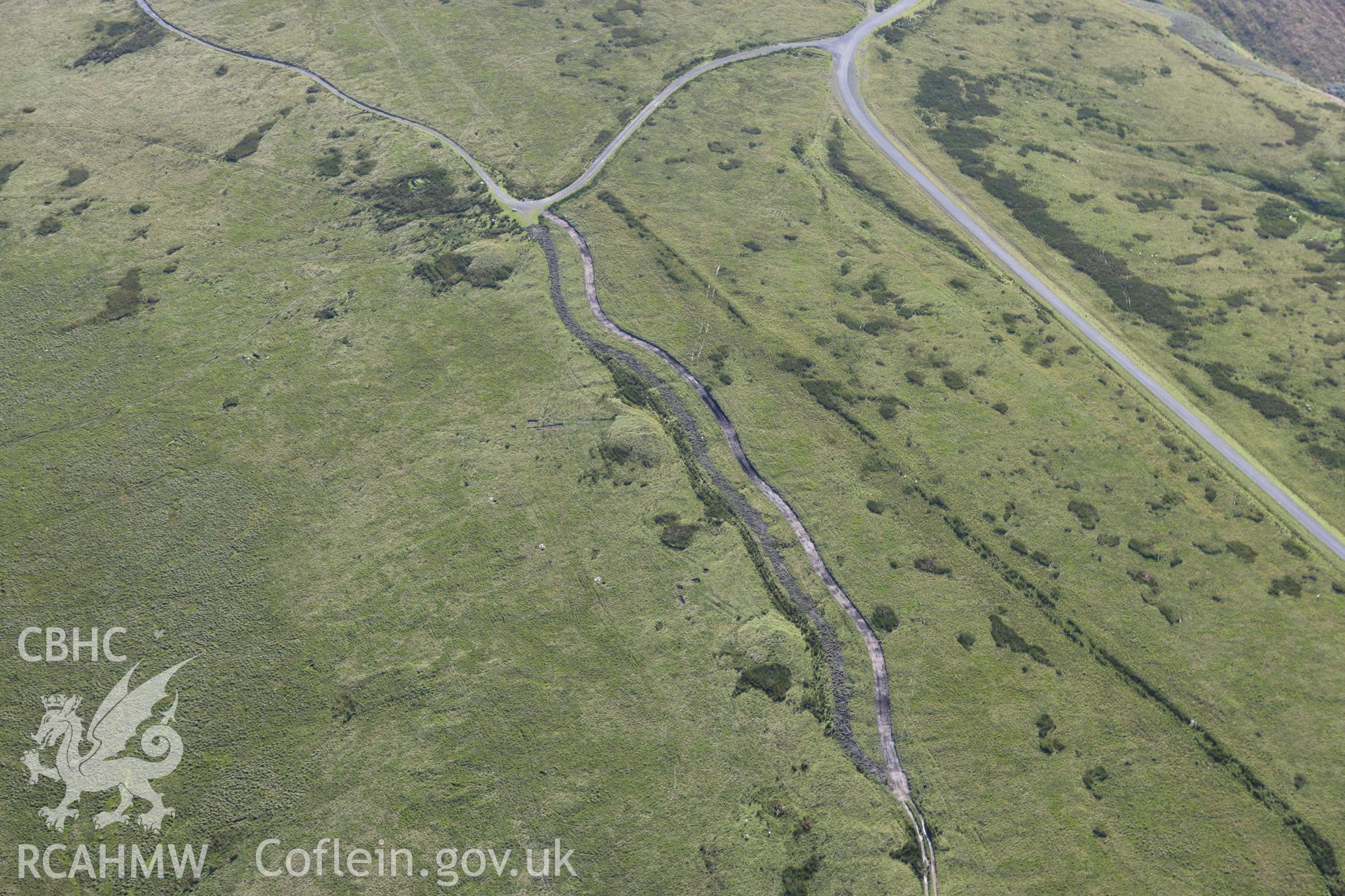 RCAHMW colour oblique aerial photograph of Tri Chrugiau Cairns I, II and III. Taken on 08 August 2007 by Toby Driver