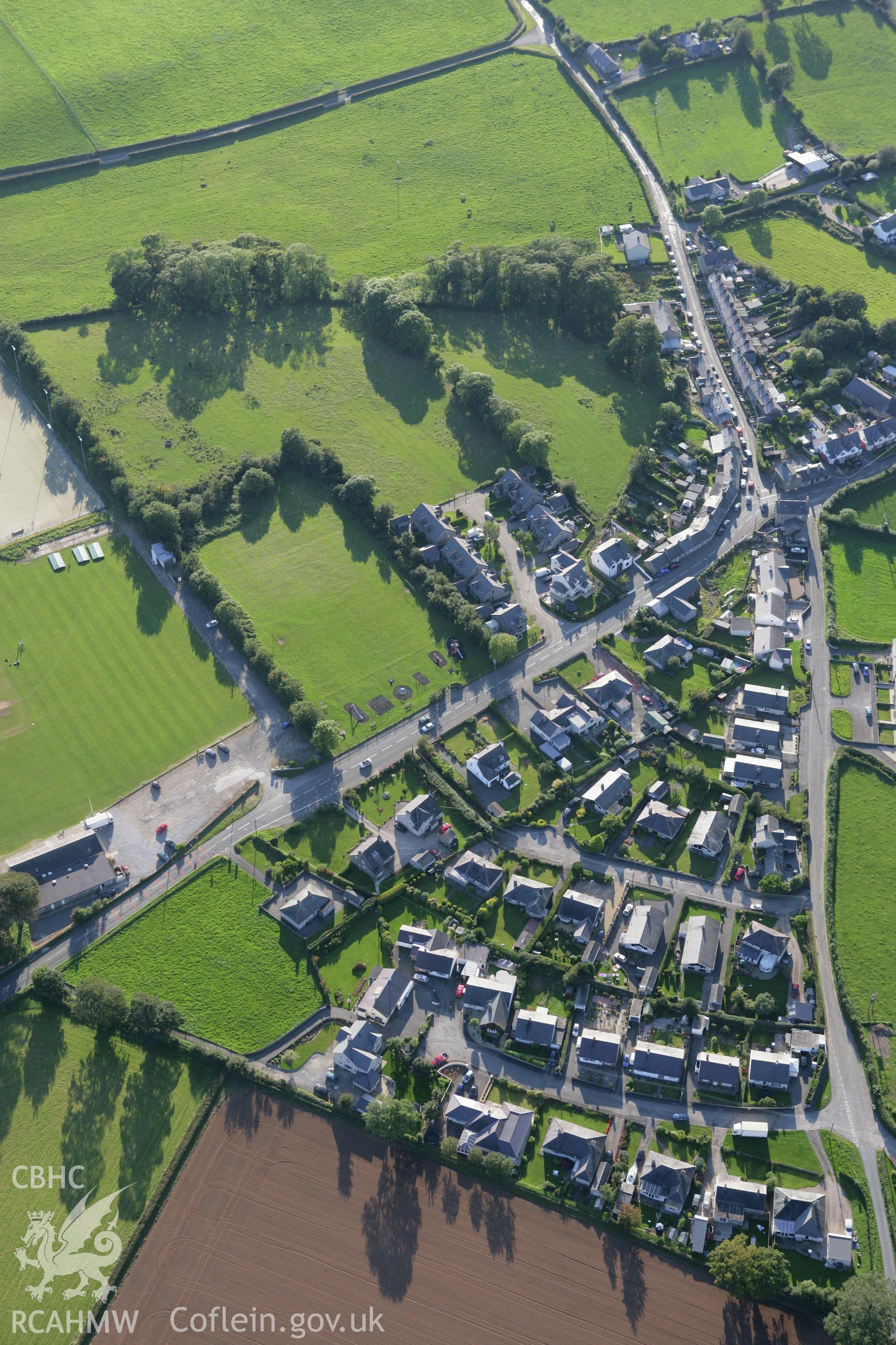 RCAHMW colour oblique aerial photograph of site of King George's Field Enclosure at Efailnewydd. Taken on 06 September 2007 by Toby Driver