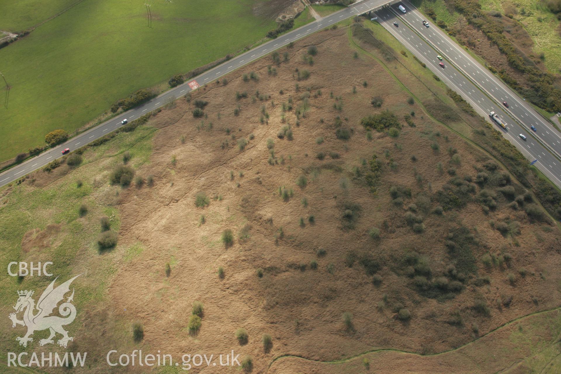 RCAHMW colour oblique aerial photograph of Croes y Ddadl Enclosure. Taken on 16 March 2007 by Toby Driver