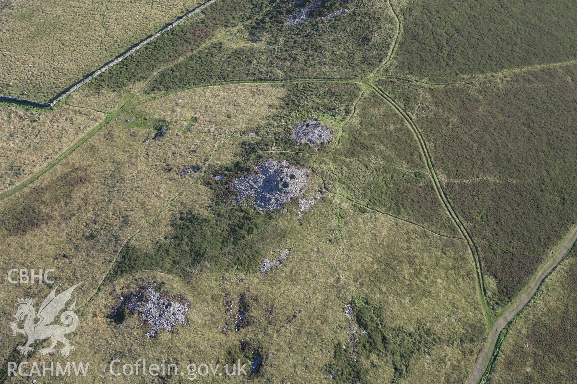 RCAHMW colour oblique aerial photograph of Mynydd Rhiw Cairn I. Taken on 06 September 2007 by Toby Driver