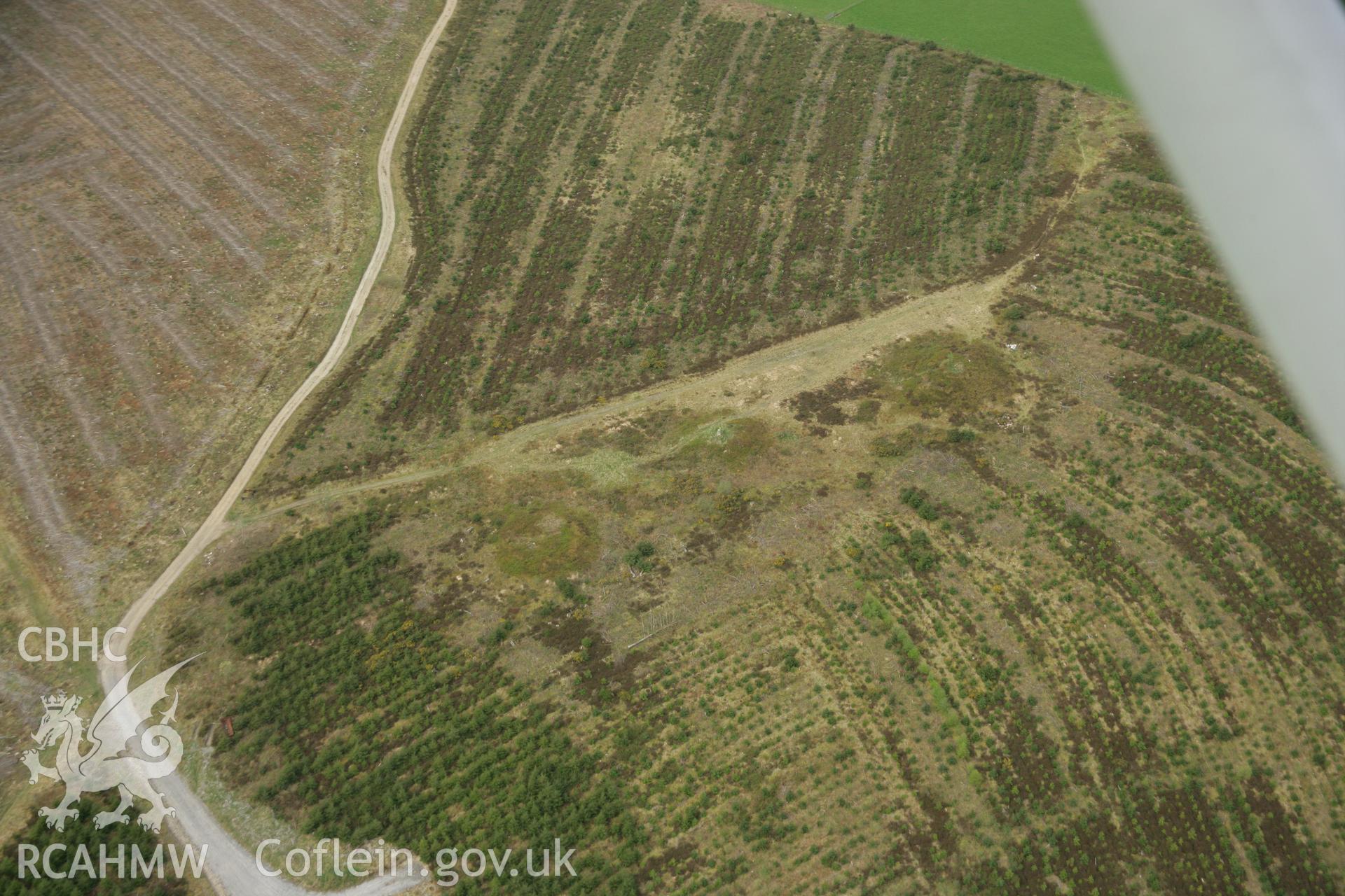 RCAHMW colour oblique aerial photograph of Trichrug Barrows. Taken on 17 April 2007 by Toby Driver