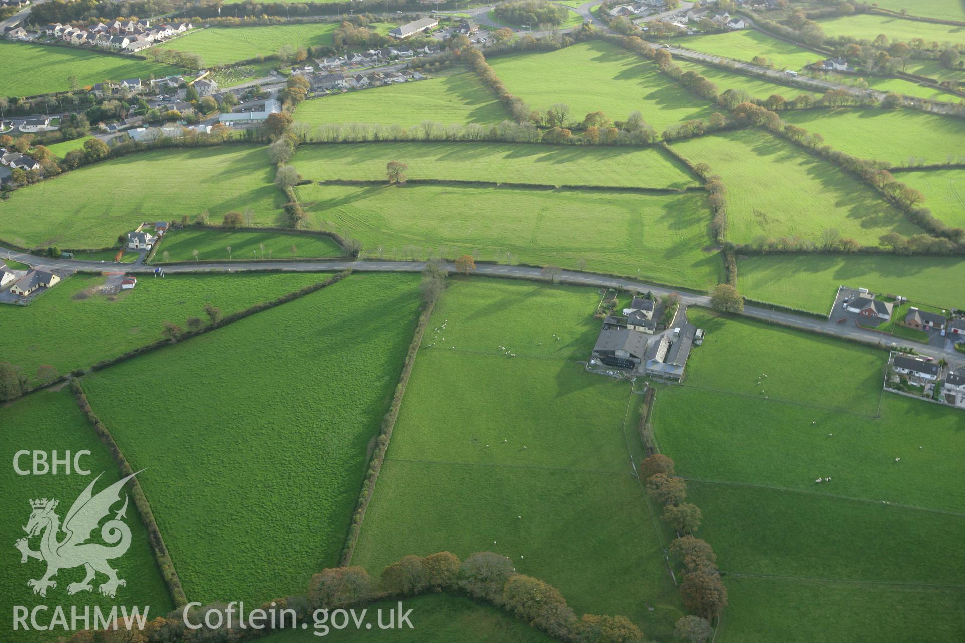 RCAHMW colour oblique photograph of Earthworks of Roman road underlying modern road, Ostrey, St. Clears. Taken by Toby Driver on 06/11/2007.