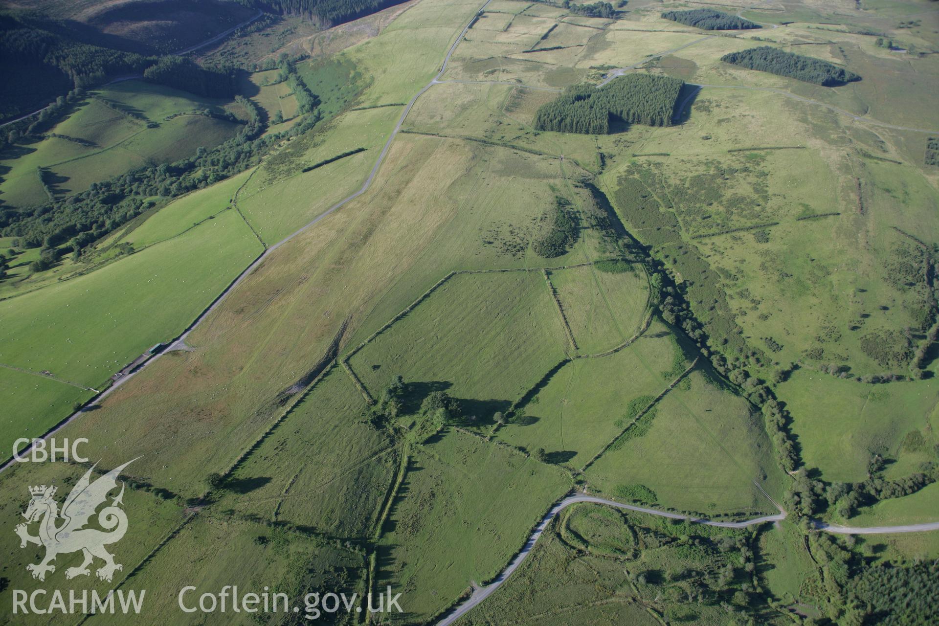 RCAHMW colour oblique aerial photograph of Clawdd Brythonig. A wide landscape view. Taken on 08 August 2007 by Toby Driver