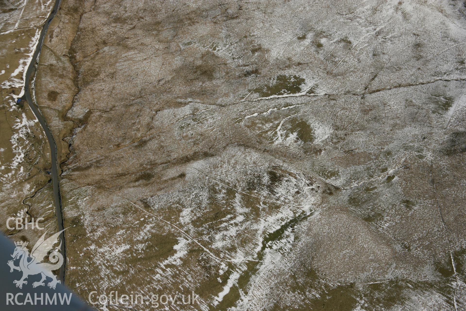 RCAHMW colour oblique aerial photograph of Waun Leuci Standing Stone . Taken on 21 March 2007 by Toby Driver