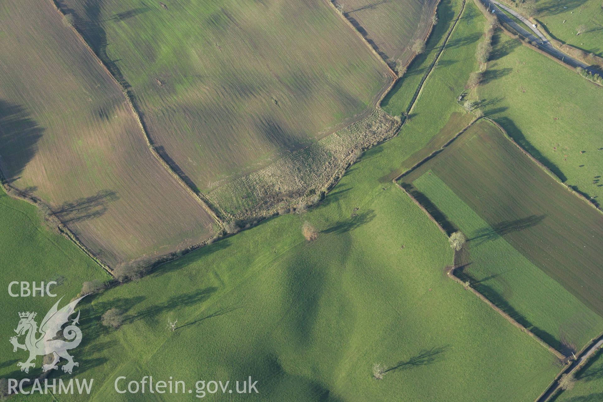 RCAHMW colour oblique photograph of Mount Cop, castle, earthworks to south of. Taken by Toby Driver on 11/12/2007.