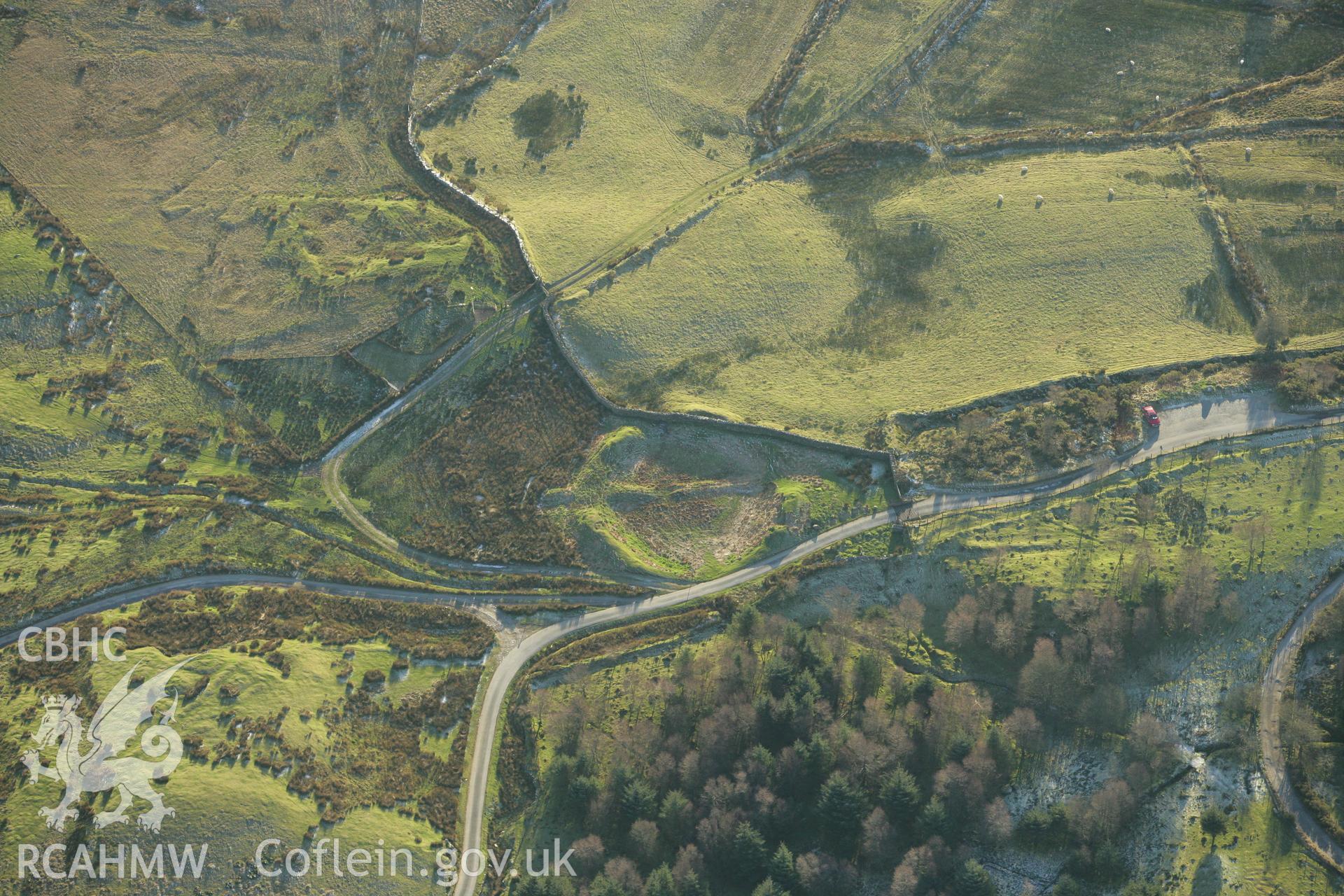 RCAHMW colour oblique photograph of Tomen y Mur Roman amphitheatre. Taken by Toby Driver on 20/12/2007.