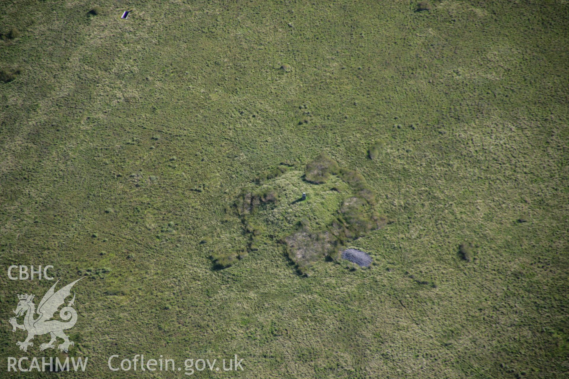 RCAHMW colour oblique aerial photograph of Ffynnon Dafydd Befan Cairn II. Taken on 08 August 2007 by Toby Driver