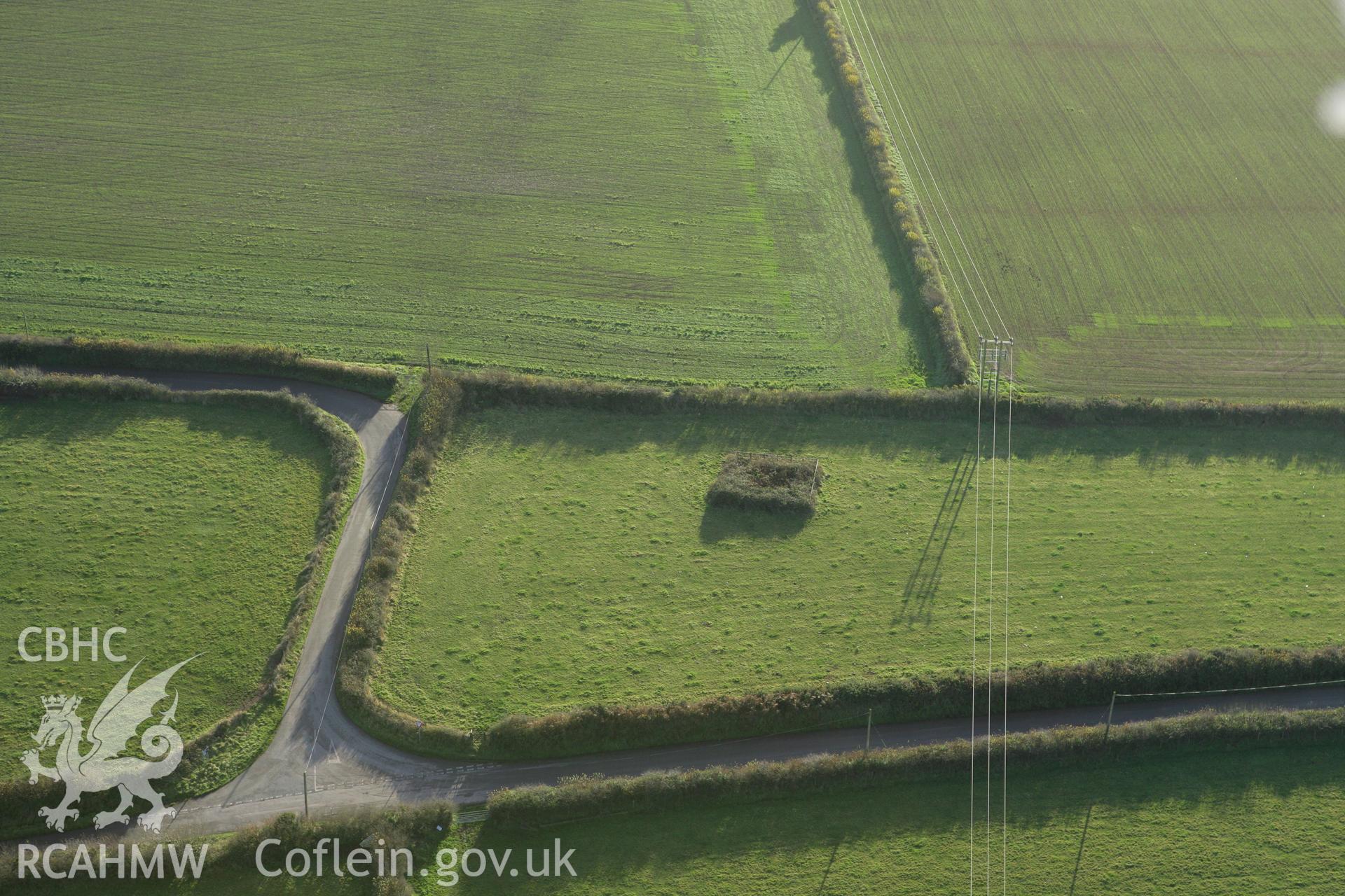 RCAHMW colour oblique photograph of Llansadurnen cross-incised stone and other stones. Taken by Toby Driver on 29/11/2007.