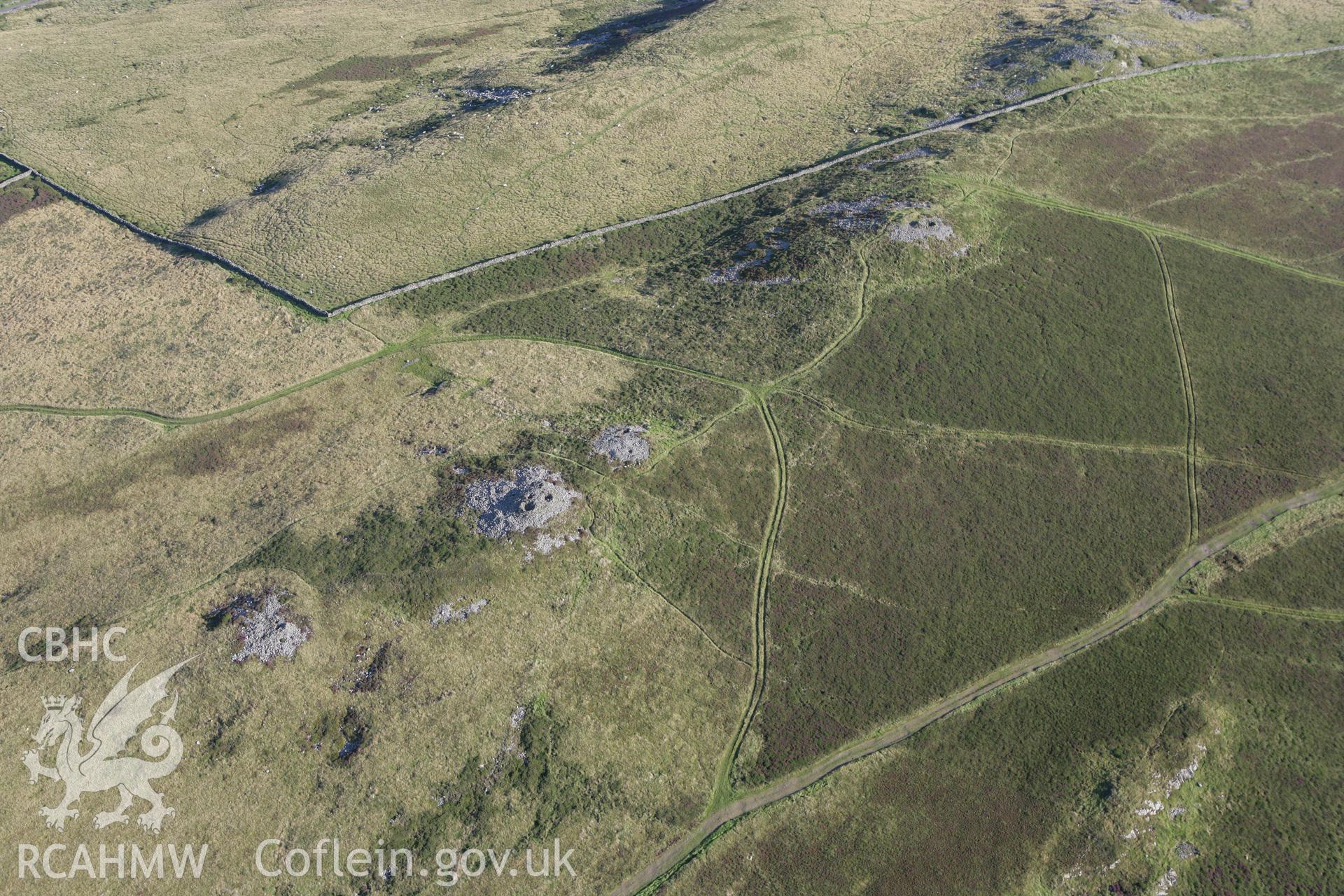 RCAHMW colour oblique aerial photograph of Mynydd Rhiw Cairn I. Taken on 06 September 2007 by Toby Driver