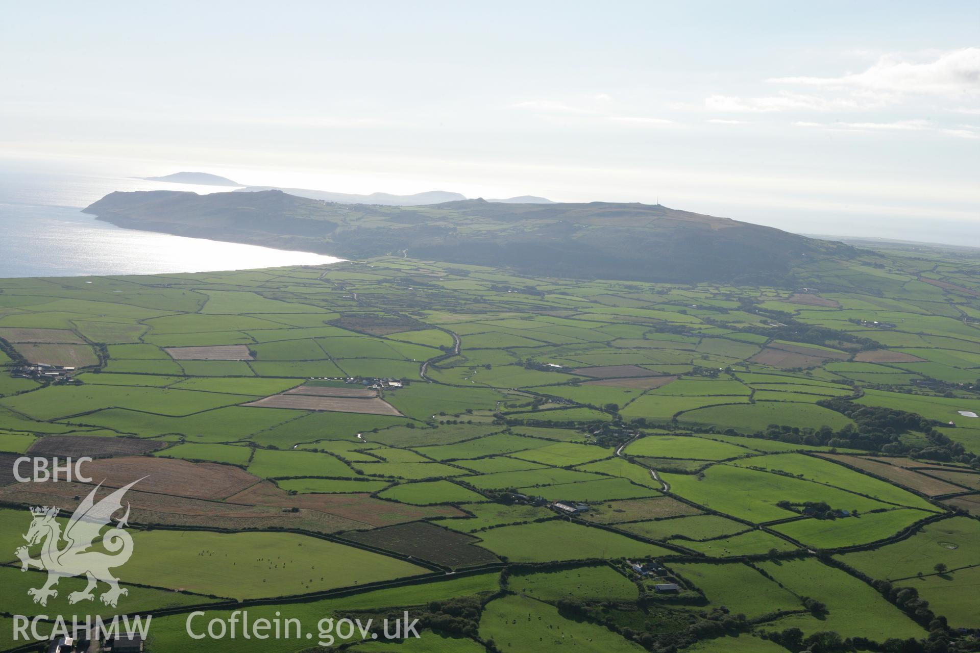 RCAHMW colour oblique aerial photograph showing landscape of Neolithic Axe Factory, Mynydd Rhiw, viewed from the east. Taken on 06 September 2007 by Toby Driver