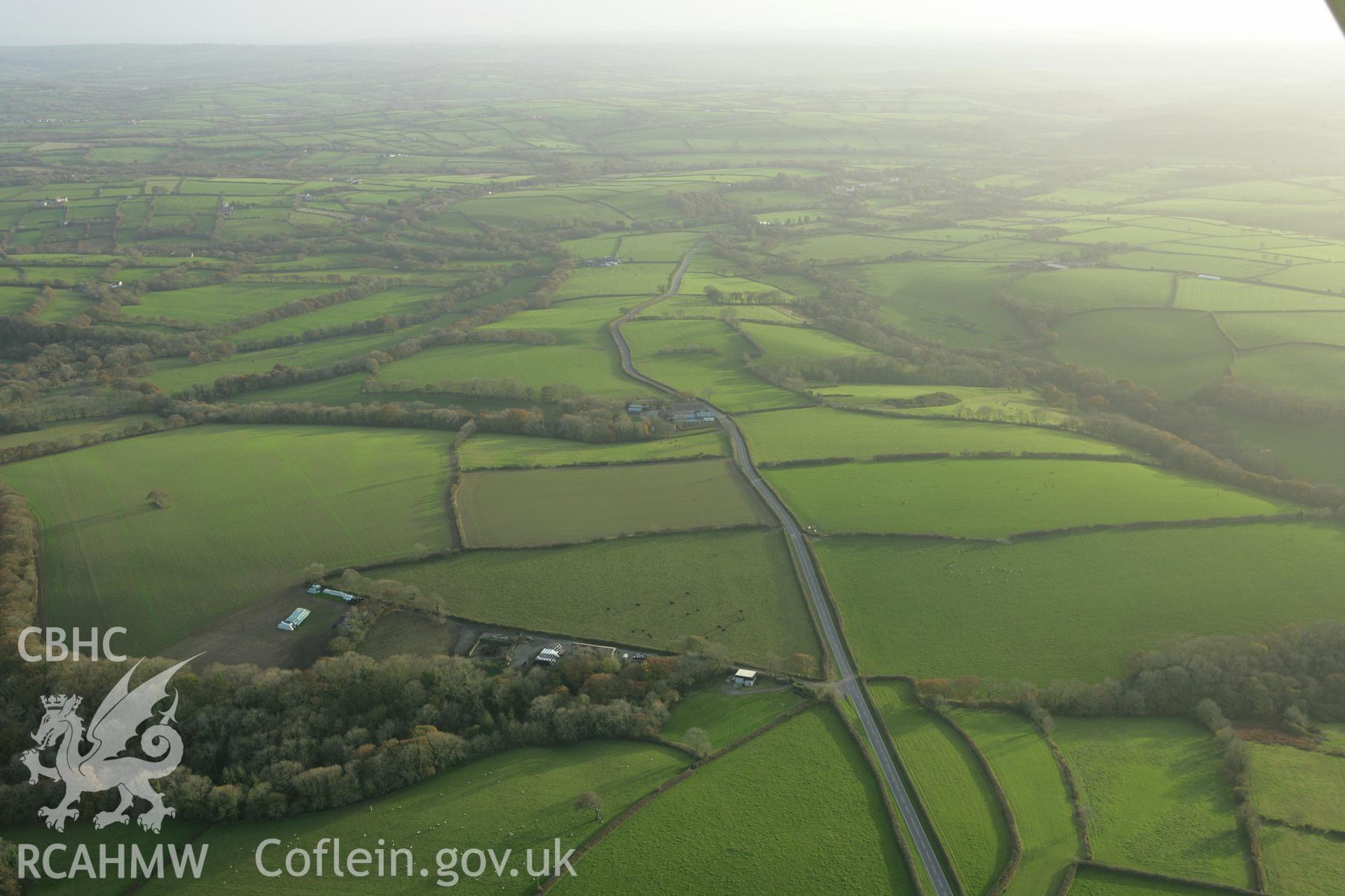 RCAHMW colour oblique photograph of Brechfa;concentric cropmark enclosure North-West of. Taken by Toby Driver on 06/11/2007.