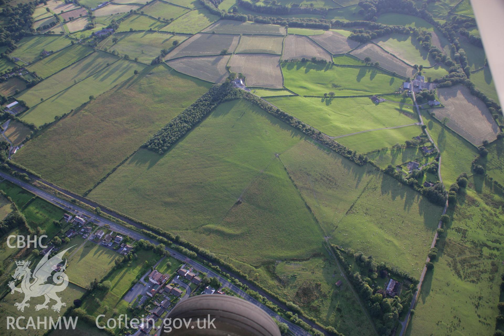 RCAHMW colour oblique aerial photograph of Llandrindod Common Roman Camp XV and Roman road Taken on 08 August 2007 by Toby Driver