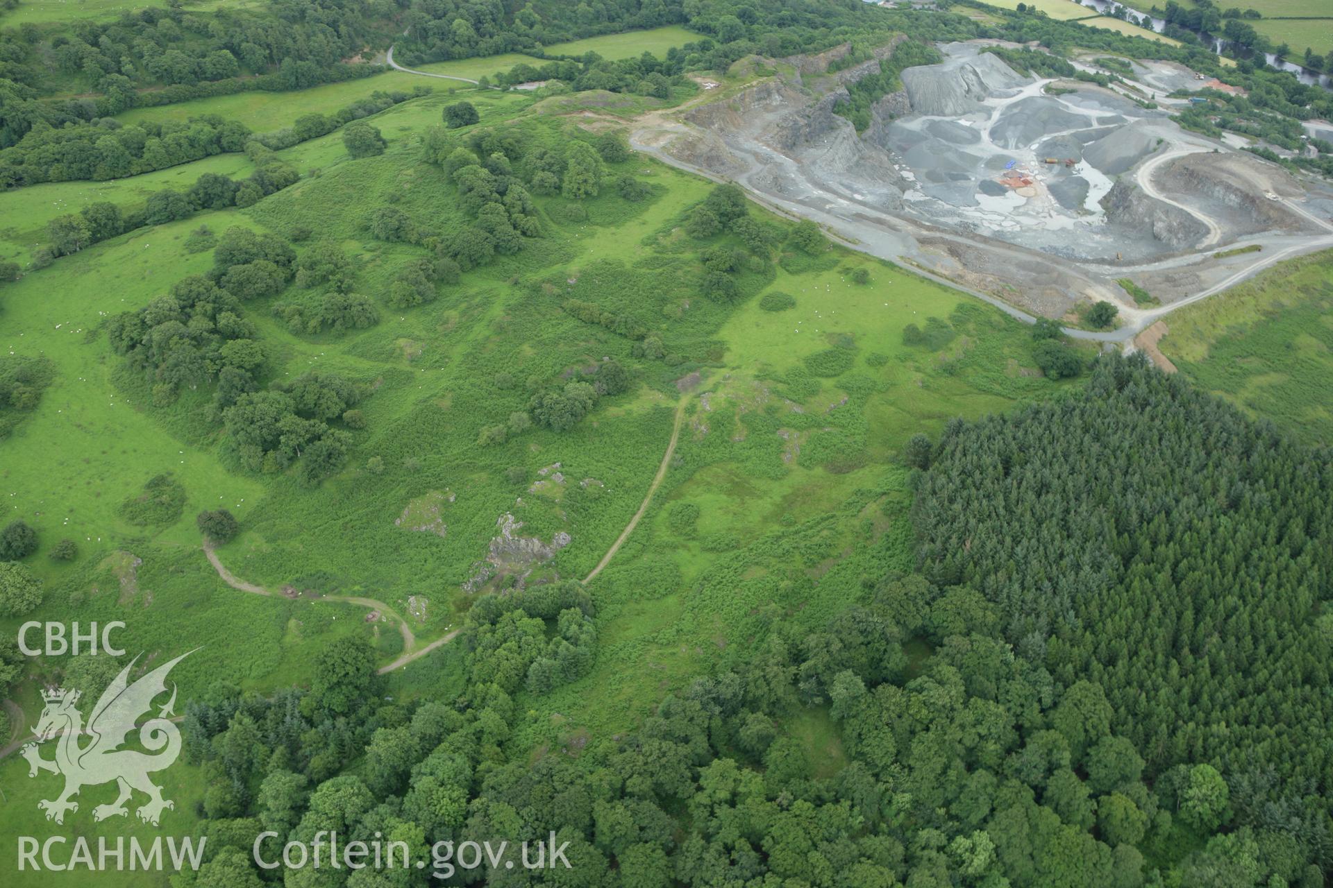 RCAHMW colour oblique aerial photograph of Llanwedd Stone Quarry and location of cairns, Builth Wells. Taken on 09 July 2007 by Toby Driver