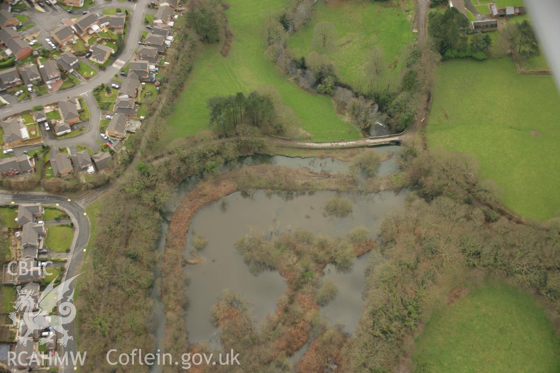 RCAHMW colour oblique aerial photograph of Afon Clydach Dam at Neath Abbey Ironworks. Taken on 16 March 2007 by Toby Driver