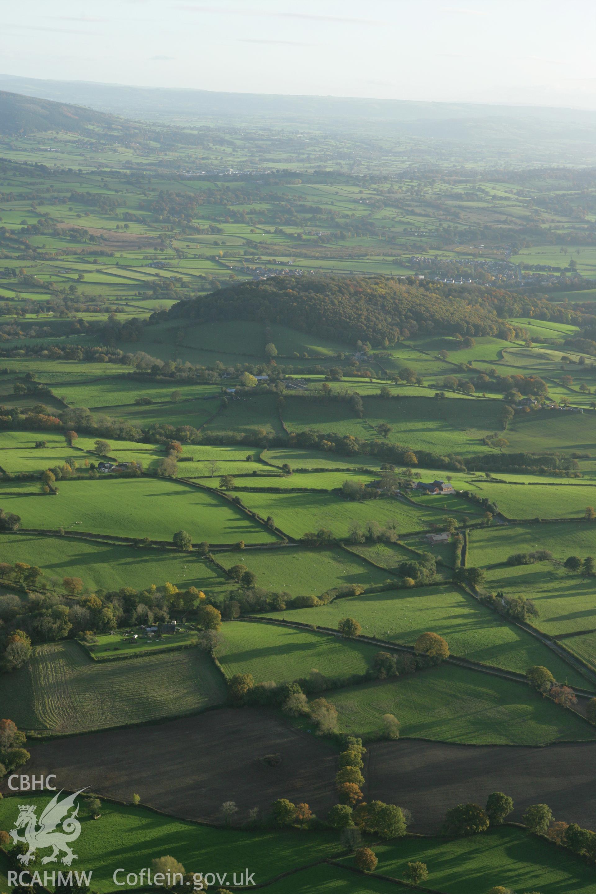 RCAHMW colour oblique photograph of Gaer Fawr hillfort, Guilsfield. Taken by Toby Driver on 30/10/2007.