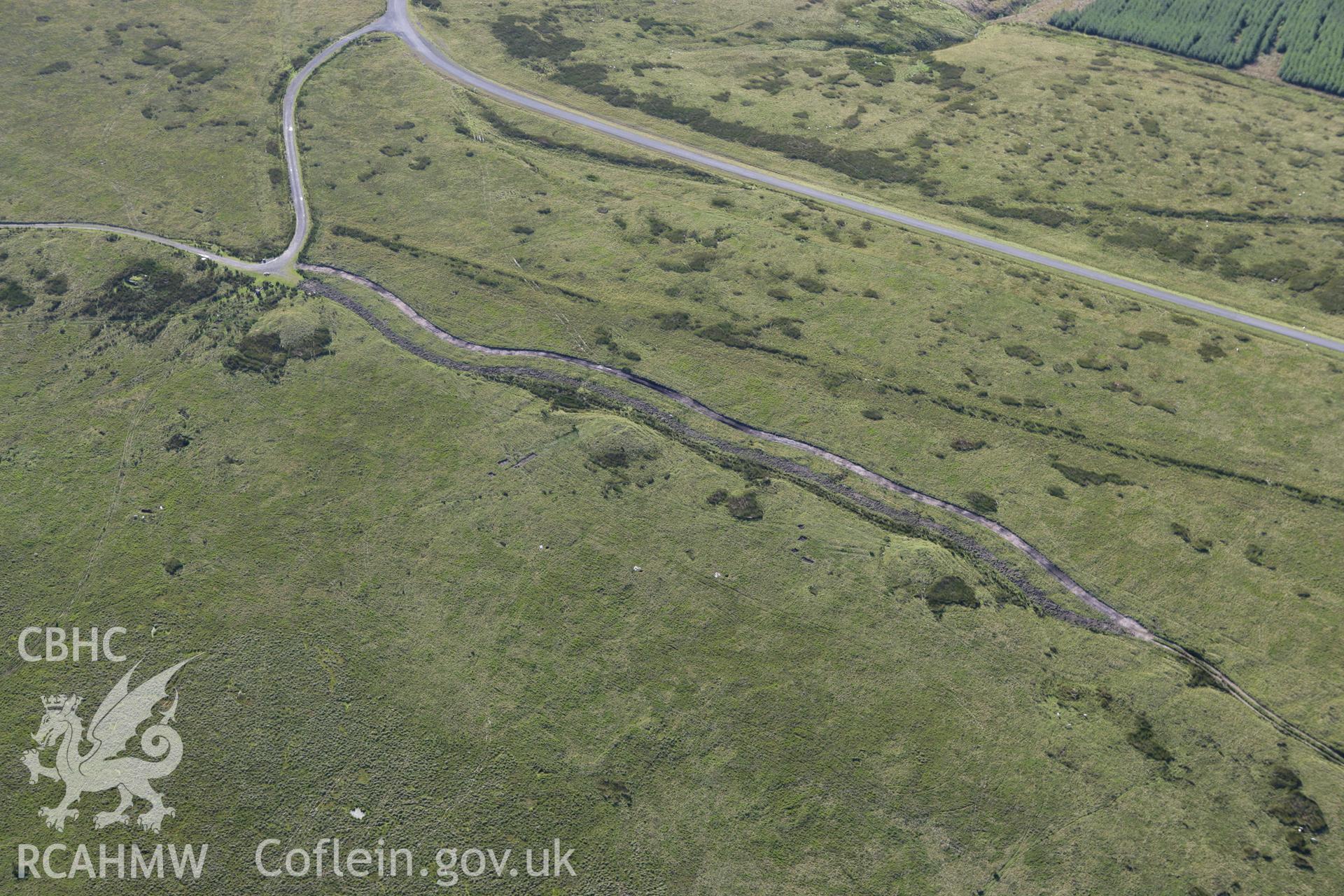 RCAHMW colour oblique aerial photograph of Tri Chrugiau Cairn I. II and III. Taken on 08 August 2007 by Toby Driver