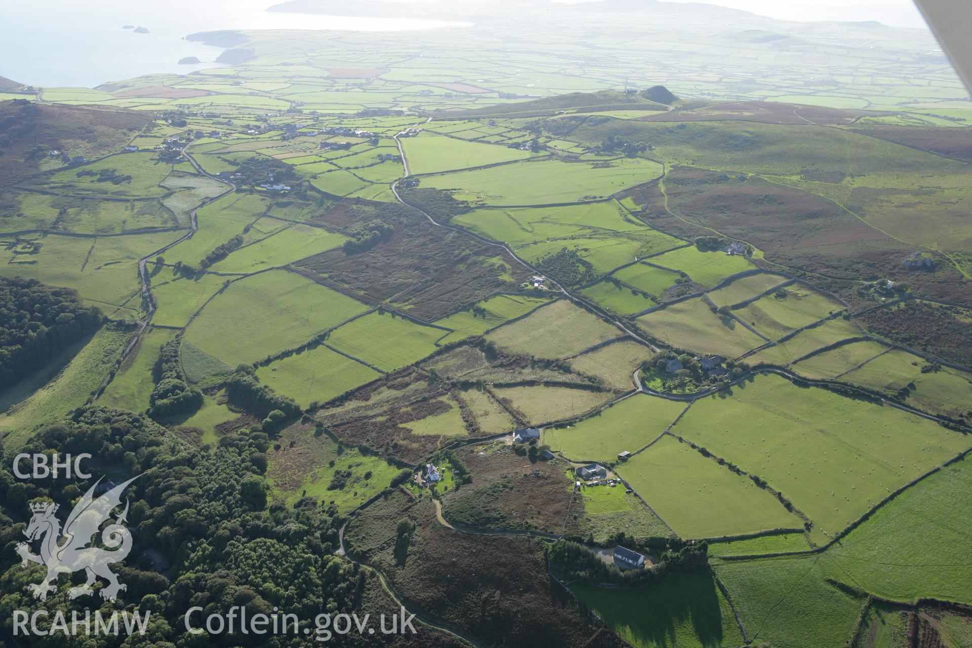 RCAHMW colour oblique aerial photograph of St Aelrhiws Church. Taken on 06 September 2007 by Toby Driver