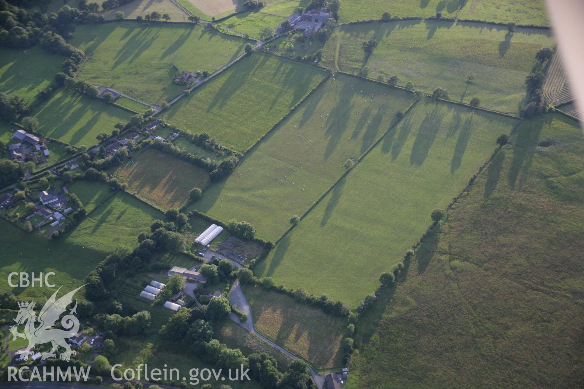 RCAHMW colour oblique aerial photograph of Llandrindod Common Roman Camp XVI. Taken on 08 August 2007 by Toby Driver