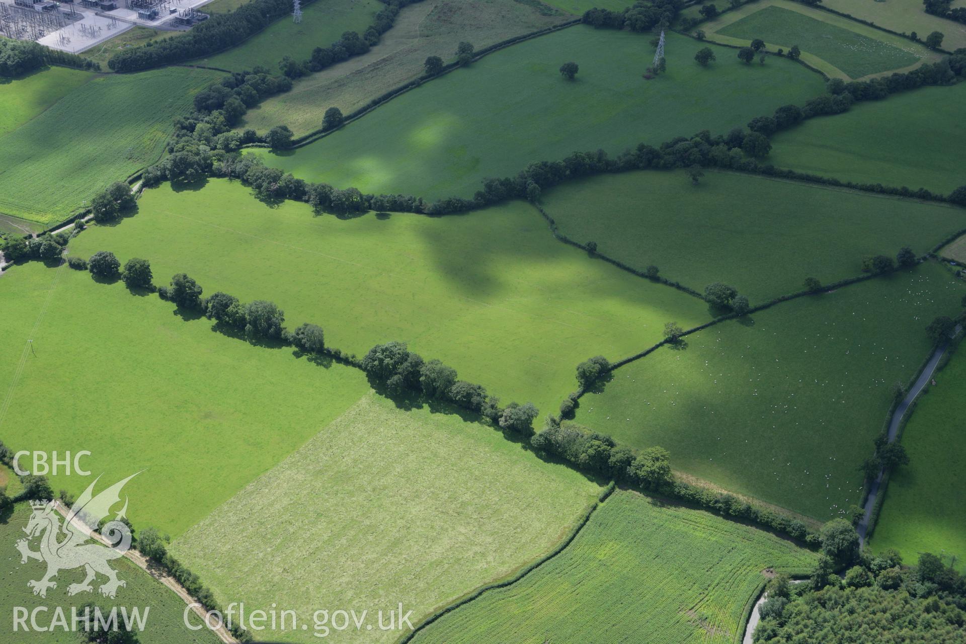 RCAHMW colour oblique aerial photograph of a section of Offa's Dyke at Cadwgan Hall extending from the River Clywedog to the railway. Taken on 24 July 2007 by Toby Driver