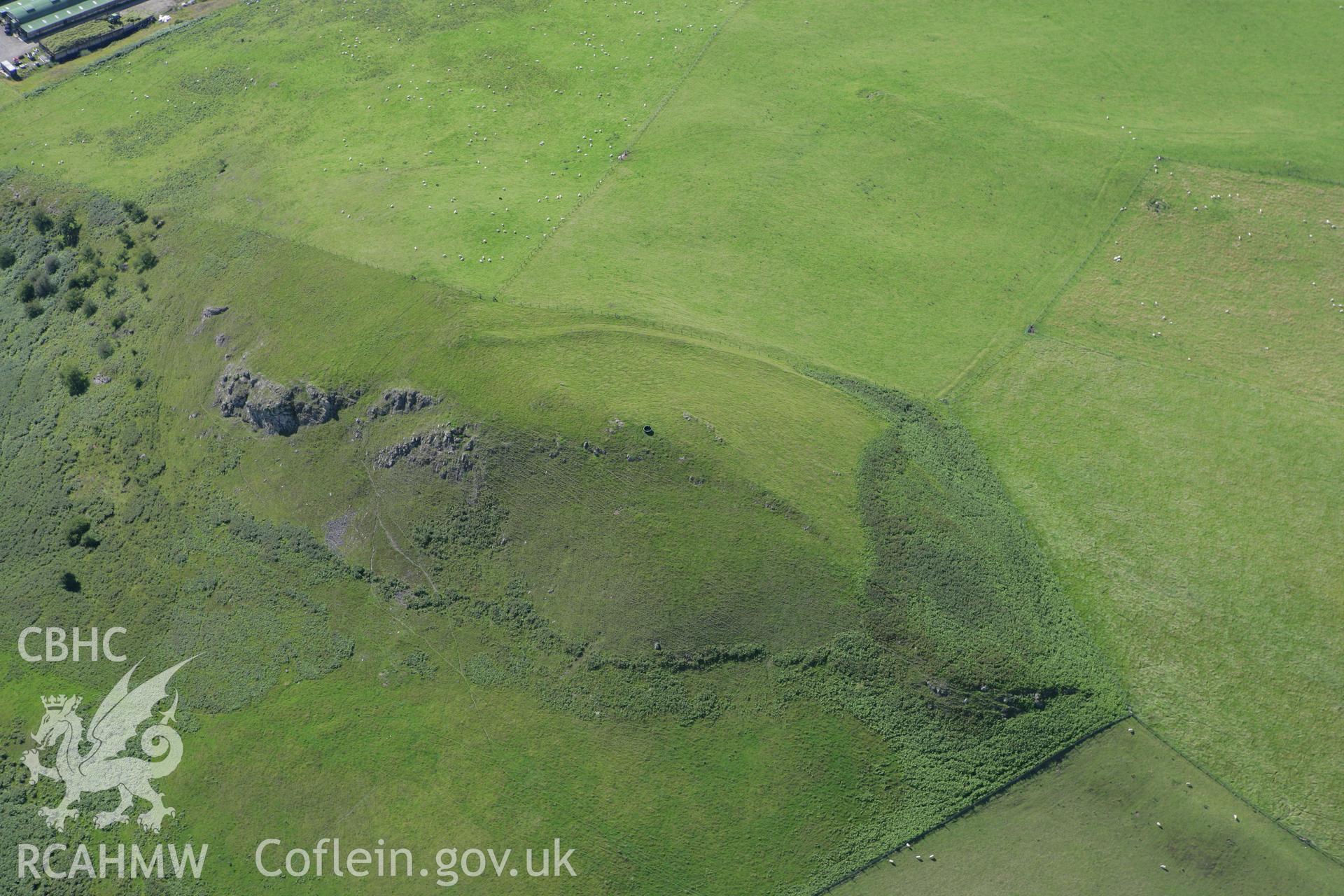 RCAHMW colour oblique aerial photograph of Careg-Wiber Defended Enclosure. Taken on 08 August 2007 by Toby Driver