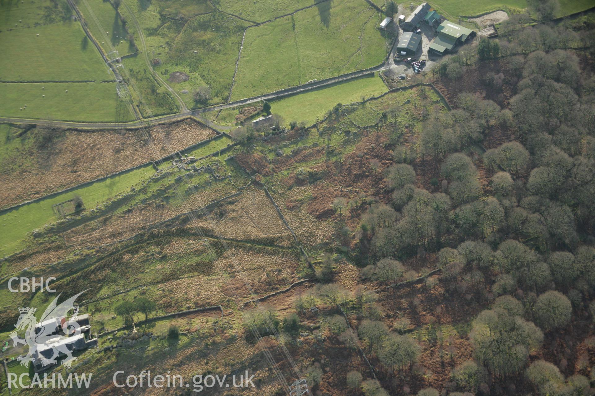 RCAHMW colour oblique aerial photograph of an enclosed hut group at Nurse Cae Du. Taken on 25 January 2007 by Toby Driver