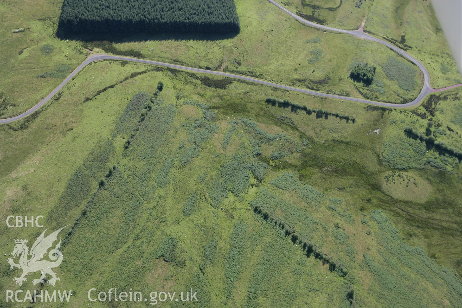 RCAHMW colour oblique aerial photograph of Cefn Corast Deserted Rural Settlement. Taken on 08 August 2007 by Toby Driver