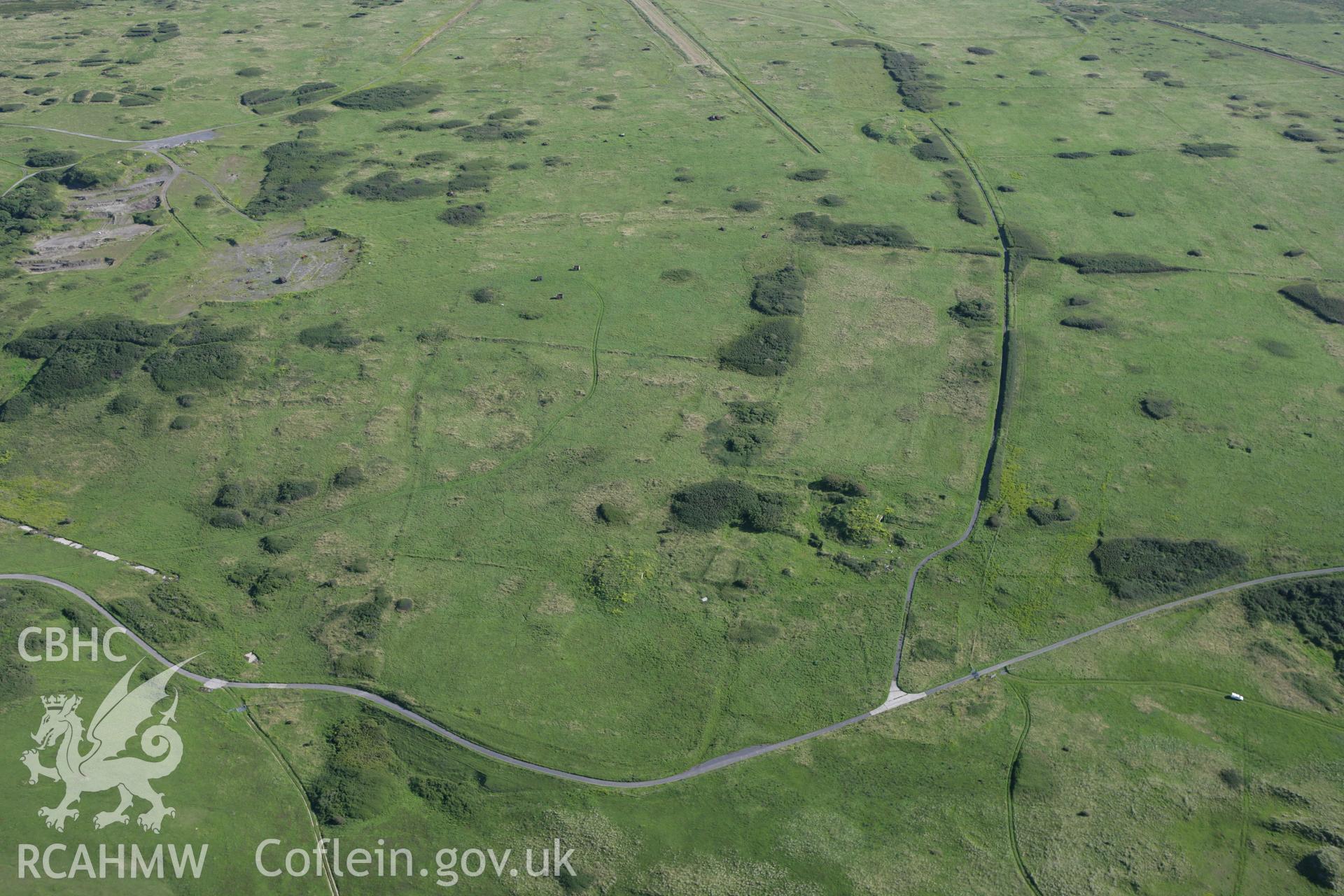 RCAHMW colour oblique aerial photograph of Linney Deserted Medieval Village. Taken on 30 July 2007 by Toby Driver