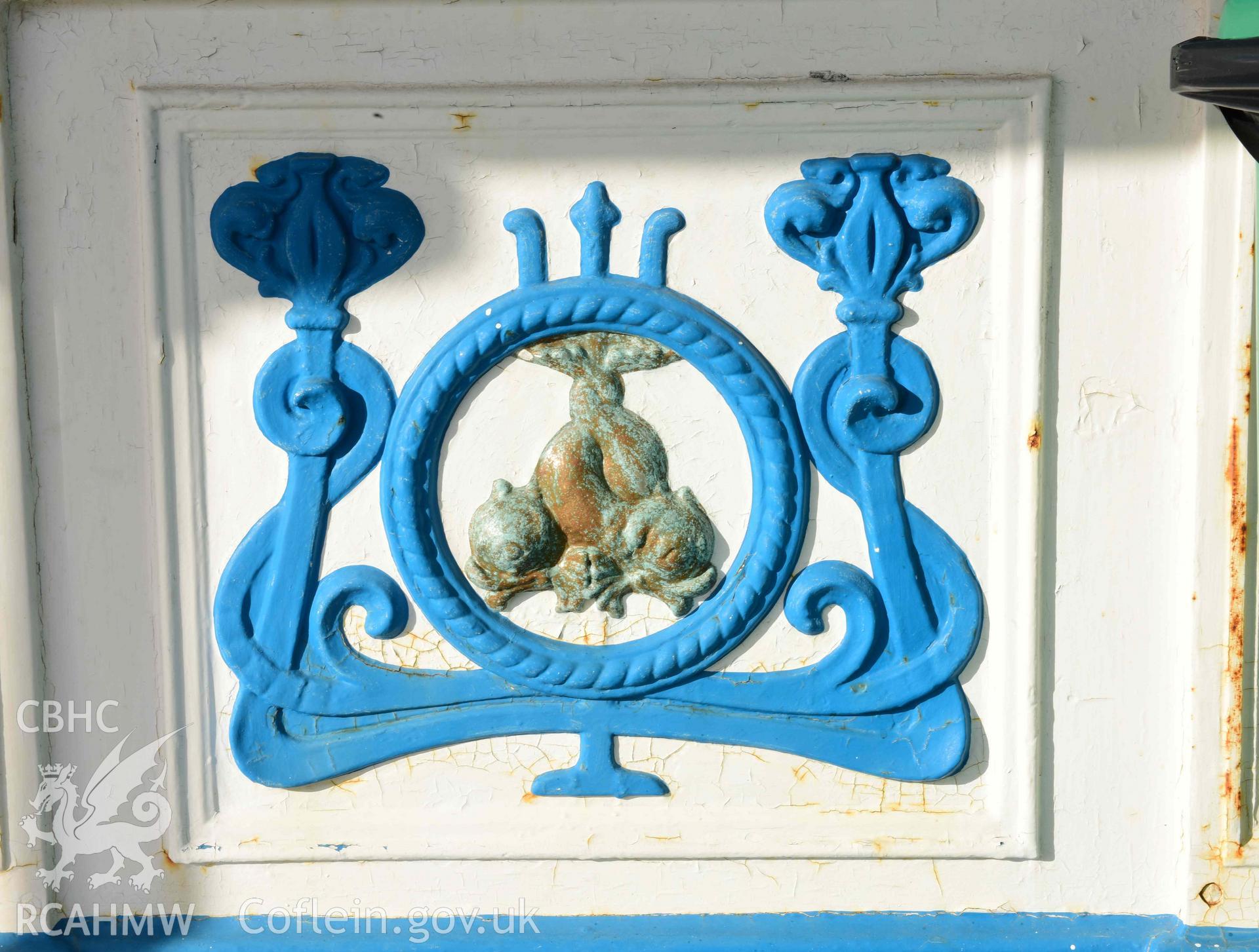 Llandudno Pier: decorative Victorian cast iron panel depicting dolphins, Pier Pavilion