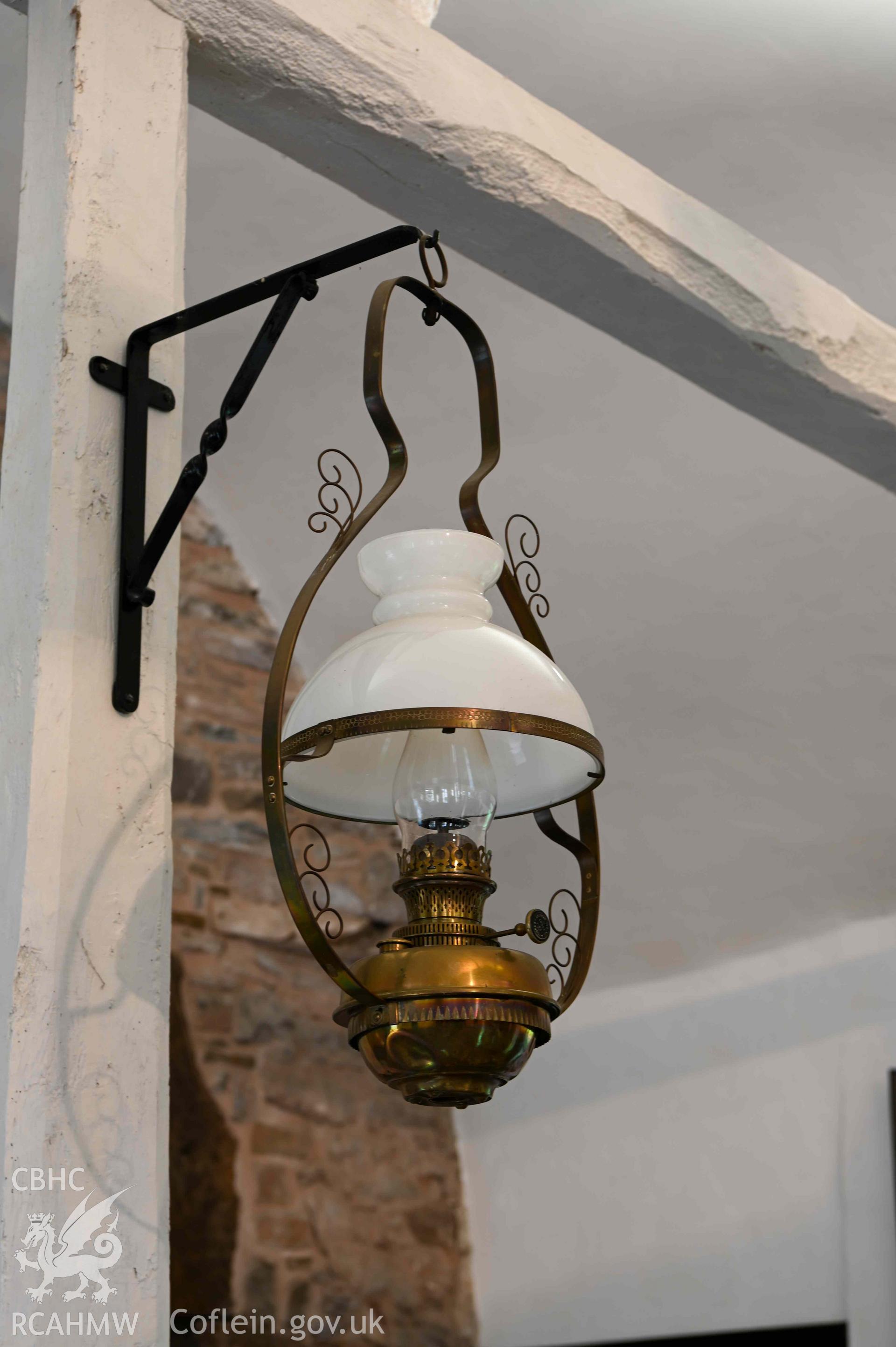 Maesyronen Chapel House - Detailed view of the second lamp on a wall-mounted bracket, taken from South