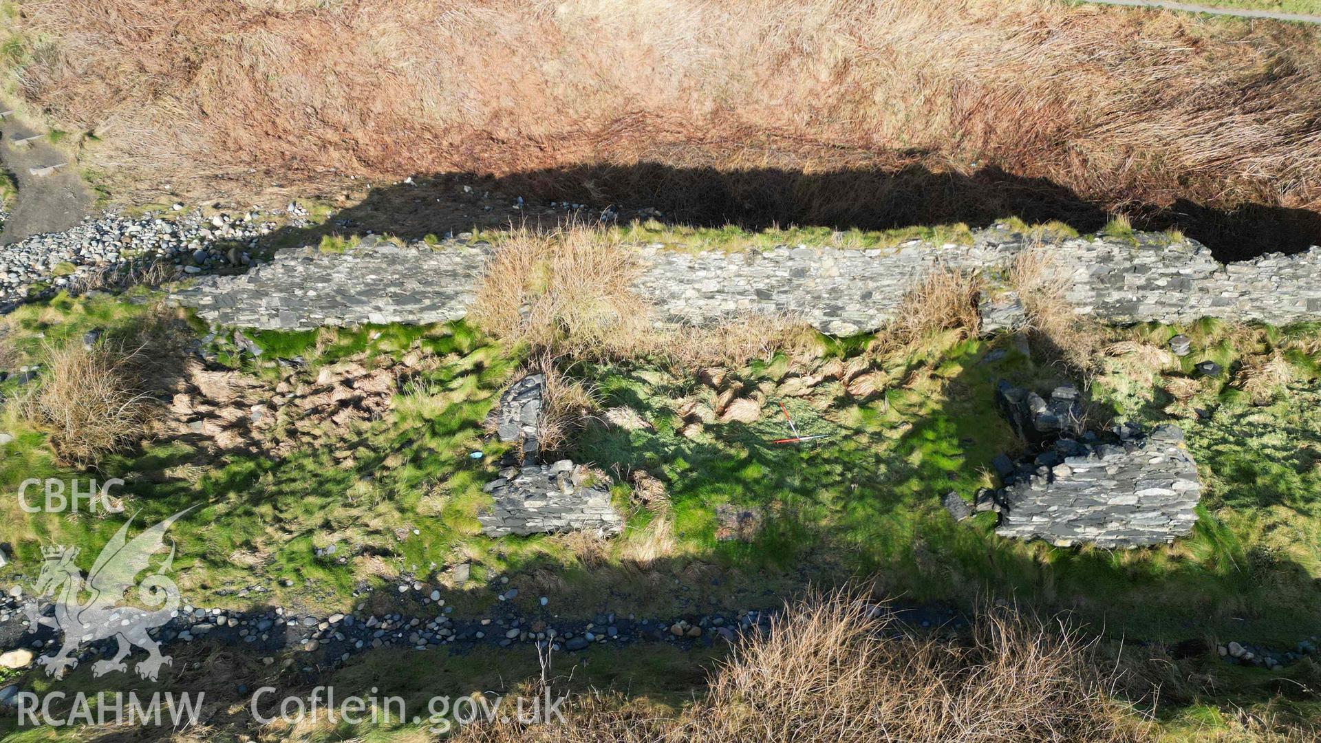 Oblique view, looking north, of Cottages 2 and 3 at Abereiddi/Abereiddy on 11/12/2024. Cottage 2 is to the left, Cottage 3 to the right with 1m scale bars within it.