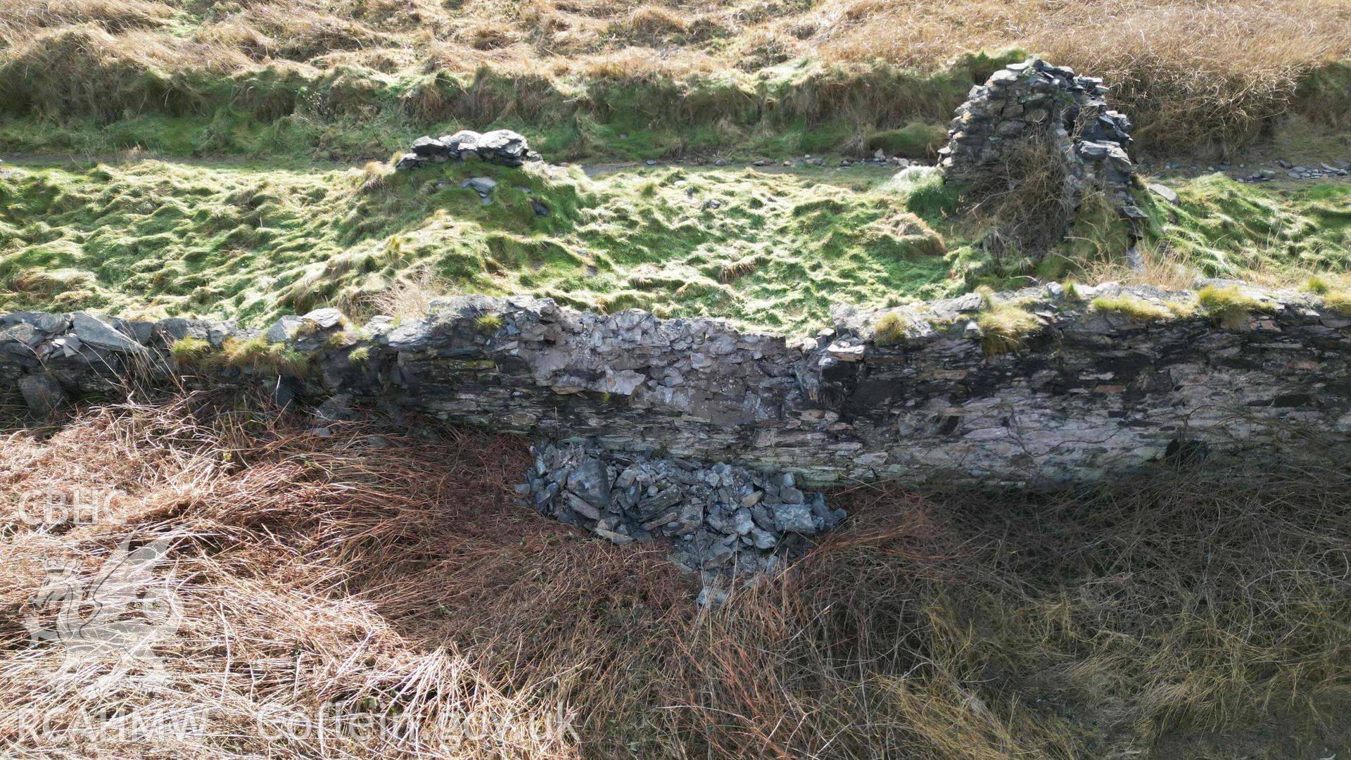 Oblique view, looking south, showing collapse to the northern wall of Cottage 4 at Abereiddi/Abereiddy on 11/12/2024.