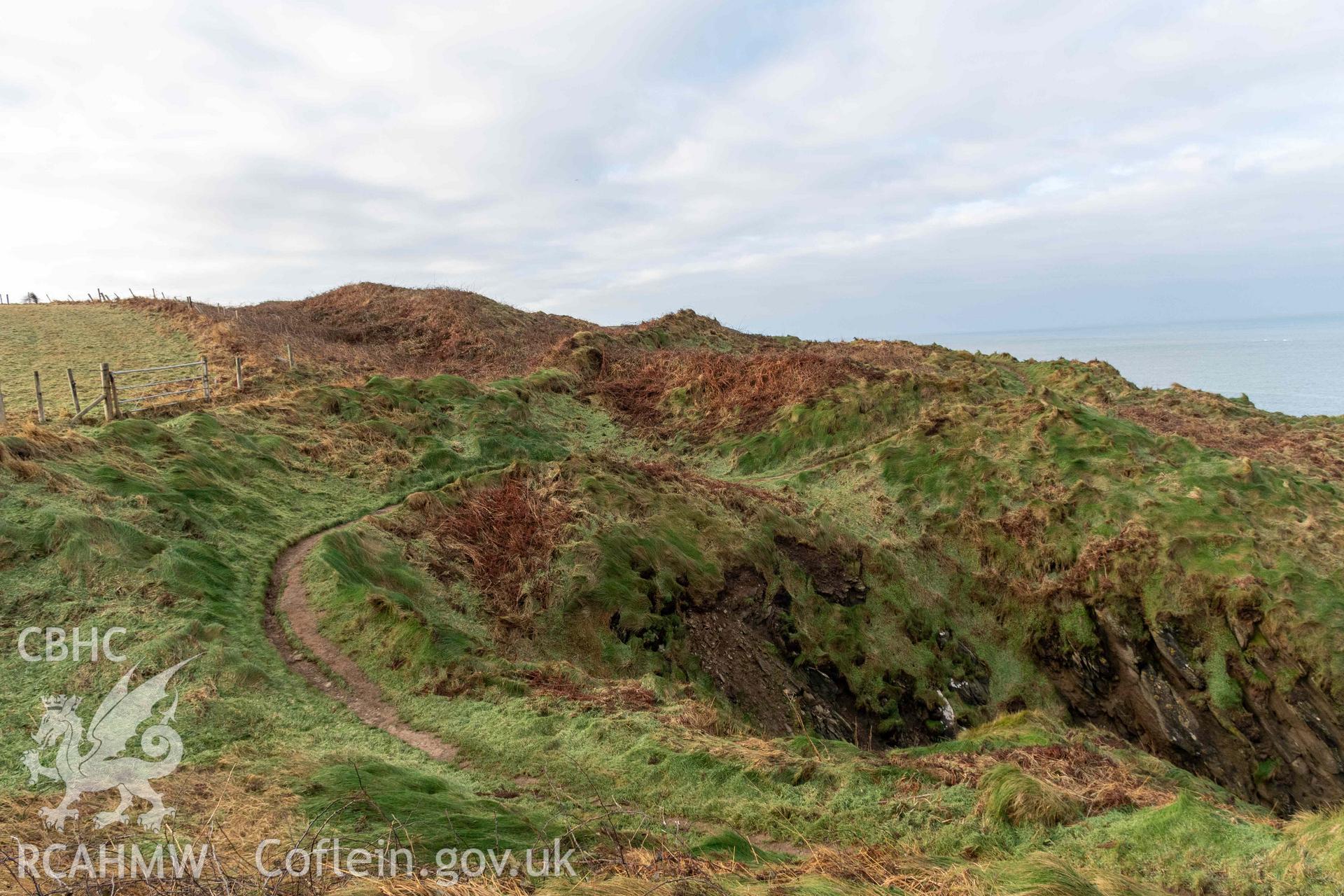 Caer Aber Pwll coastal promontory fort. Looking west from the eastern edge of the fort across the outer and middle defences.