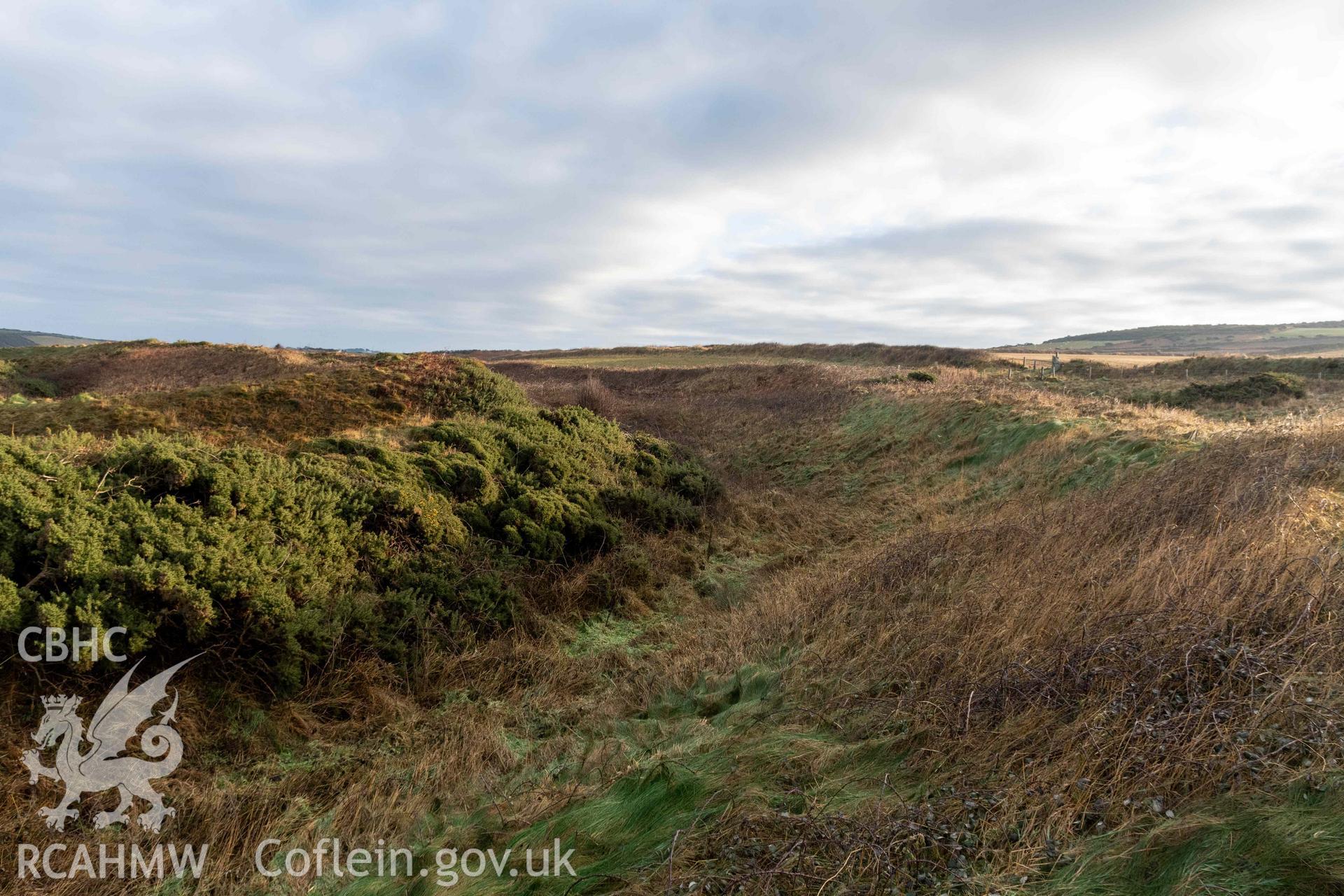 Caer Aber Pwll coastal promontory fort. Looking east along the ditch between the outer and middle banks on the south side of the fort.