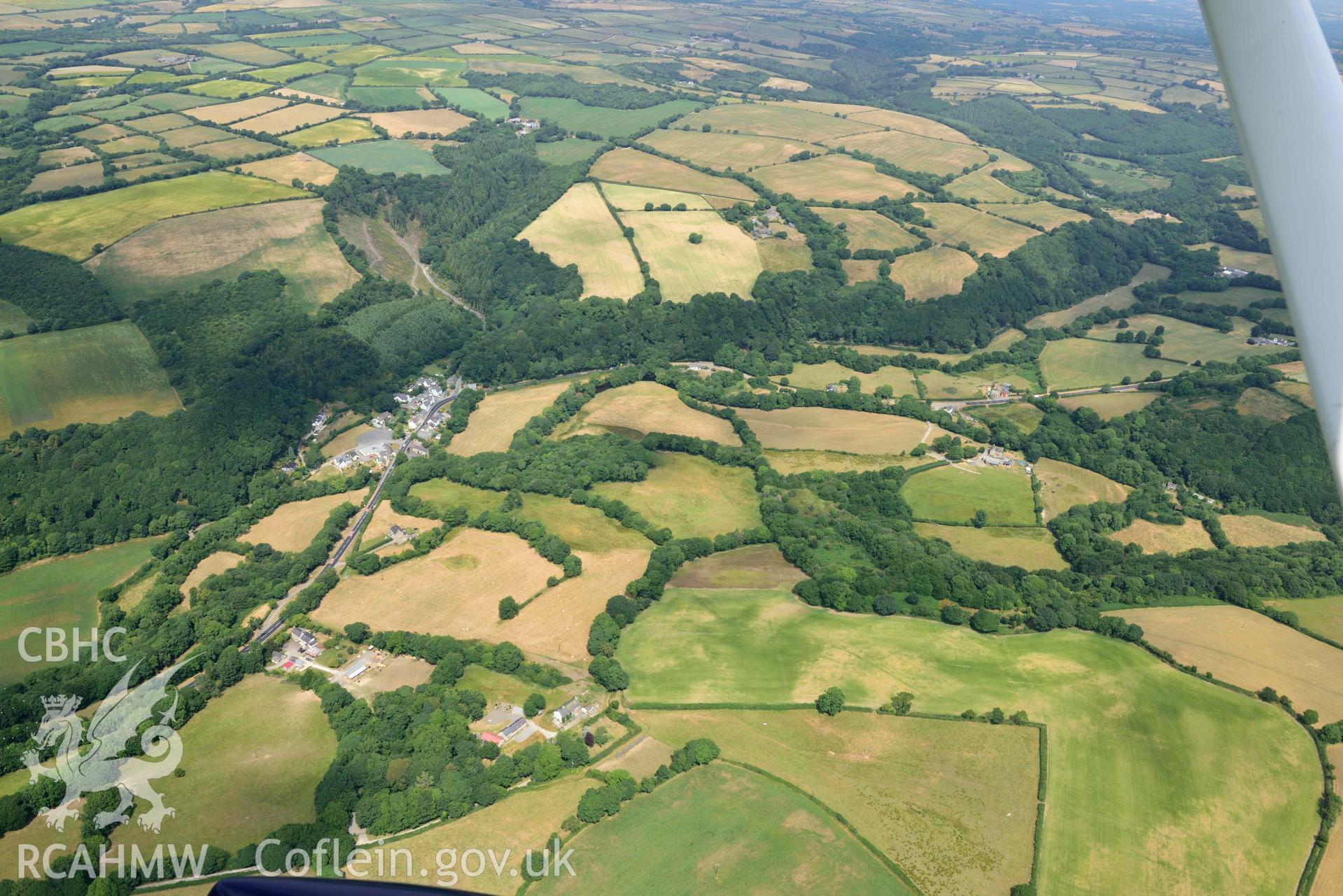 RCAHMW colour oblique aerial photograph of Felindre Farchog village with parching taken on 11 July 2018 by Toby Driver