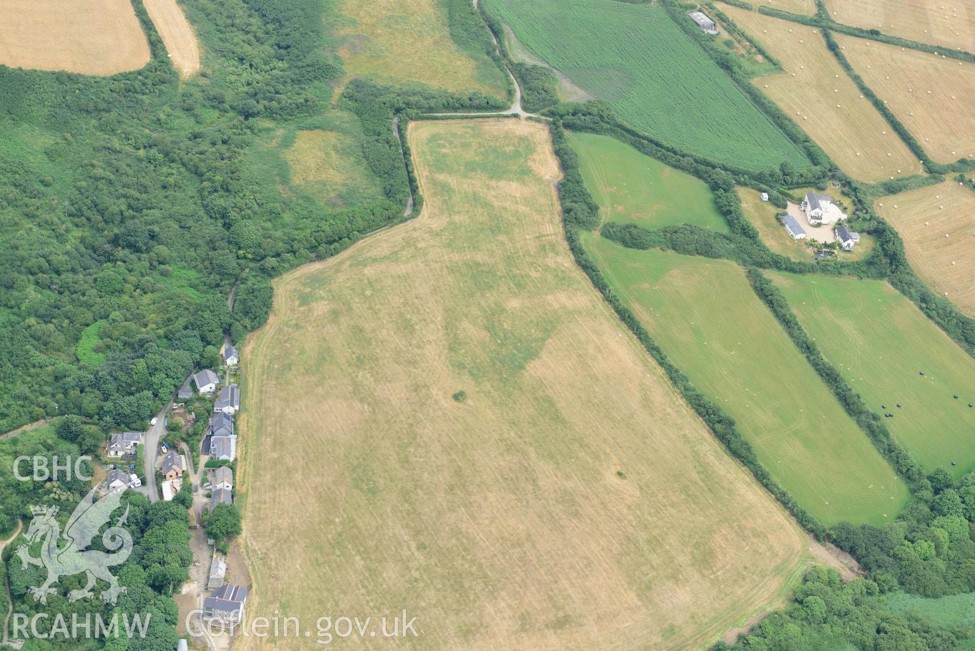 RCAHMW colour oblique aerial photograph of  Swanswell Farm, Broadhaven, defended enclosure CM taken on 11 July 2018 by Toby Driver